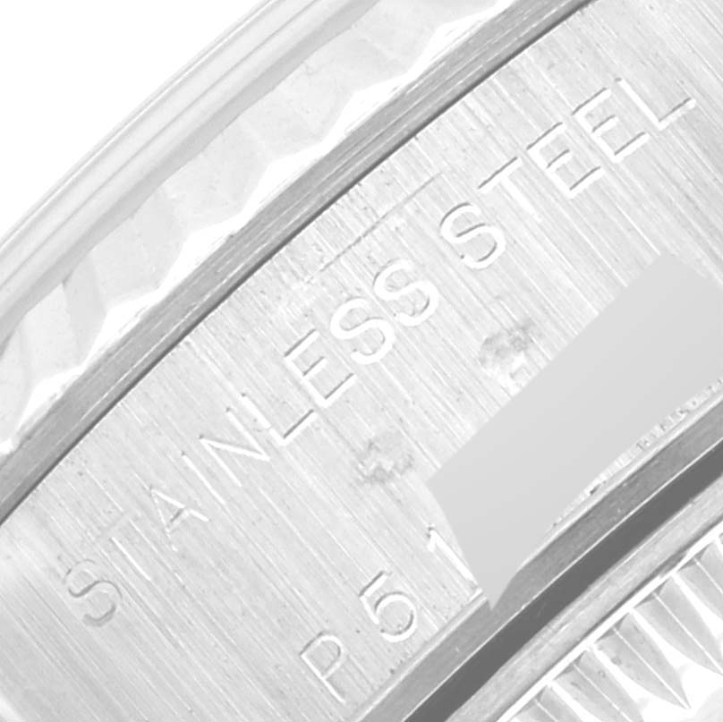 The image shows a close-up of the stainless steel engraving on the case back of the Rolex Datejust 79174 Women's Stainless Steel Silver Dial 79174 Women's Stainless Steel Silver Dial watch.