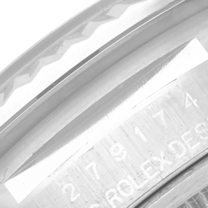 The image shows a close-up angle of the etched serial number and part of the bezel of a Rolex Datejust 279174 Women's Stainless Steel Grey Dial 279174 Women's Stainless Steel Grey Dial watch.