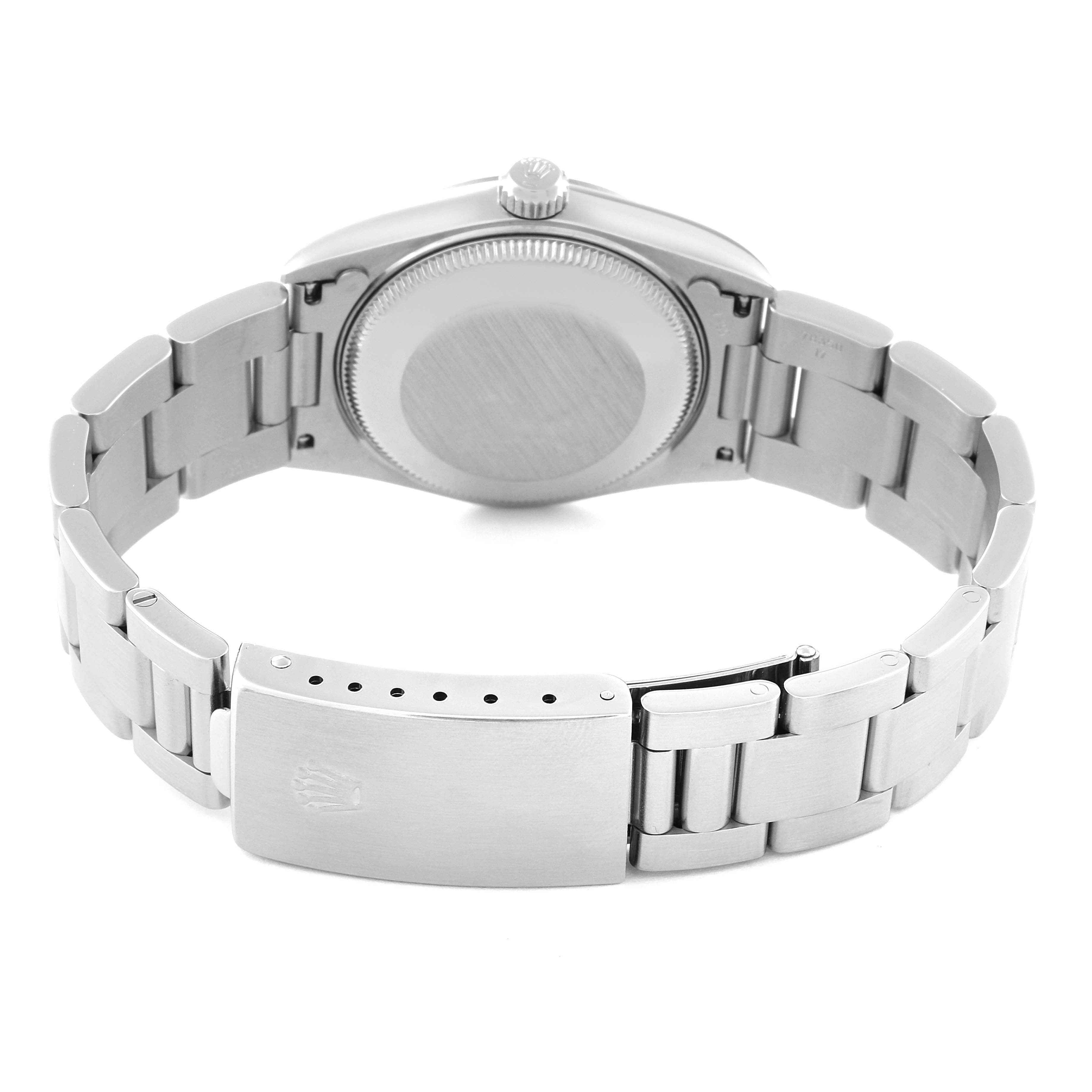 The image shows the back case and bracelet clasp of a Rolex Mid-Size 78240 Women
s Stainless Steel Blue Dial 78240 Women
s Stainless Steel Blue Dial watch from a rear angle.