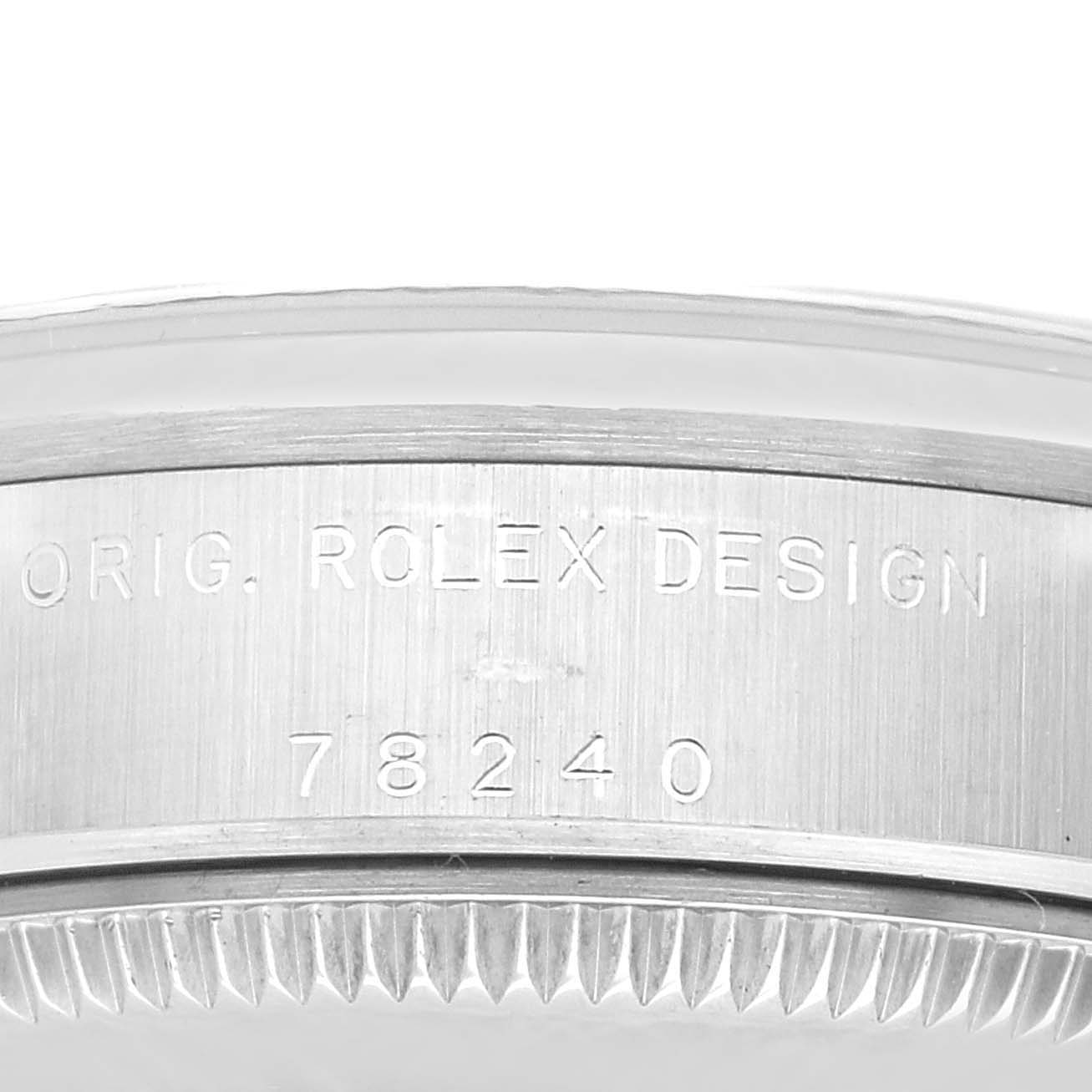The image shows a close-up of the side engraving on the bezel of a Rolex Mid-Size 78240 Women
s Stainless Steel Blue Dial 78240 Women
s Stainless Steel Blue Dial model watch, displaying "ORIG. ROLEX DESIGN" and the number "78240."