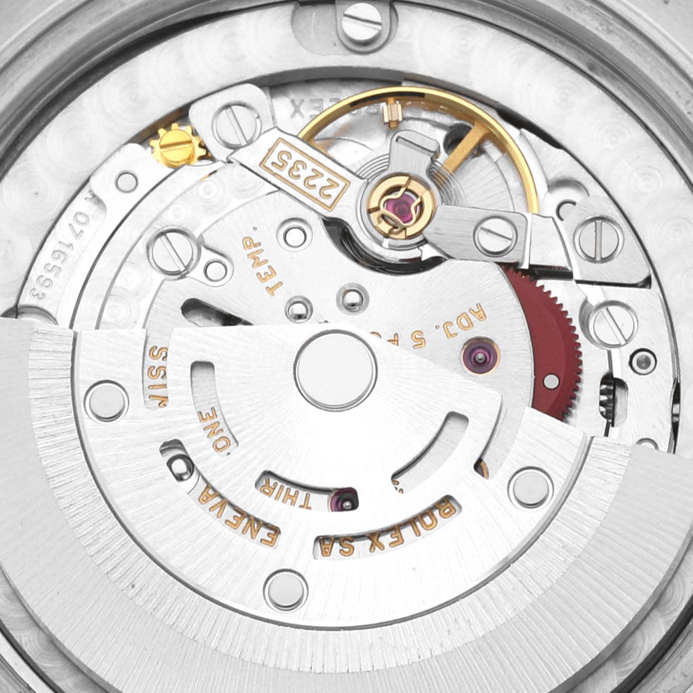 This image shows a close-up view of the movement mechanism of a mid-size Rolex watch, highlighting intricate components like gears and rotors.