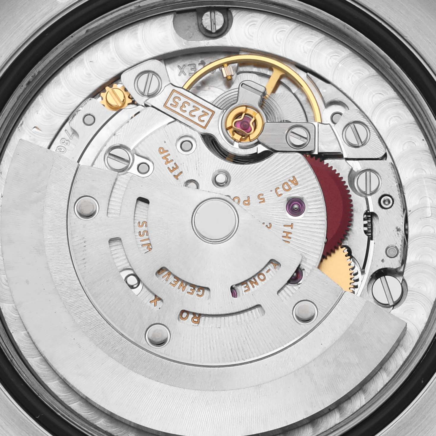 The image shows the movement of a Rolex Mid-Size 178341 Women's Steel and Gold (two tone) Silver Dial 178341 Women's Steel and Gold (two tone) Silver Dial watch from a top-down angle, highlighting gears and the rotor.