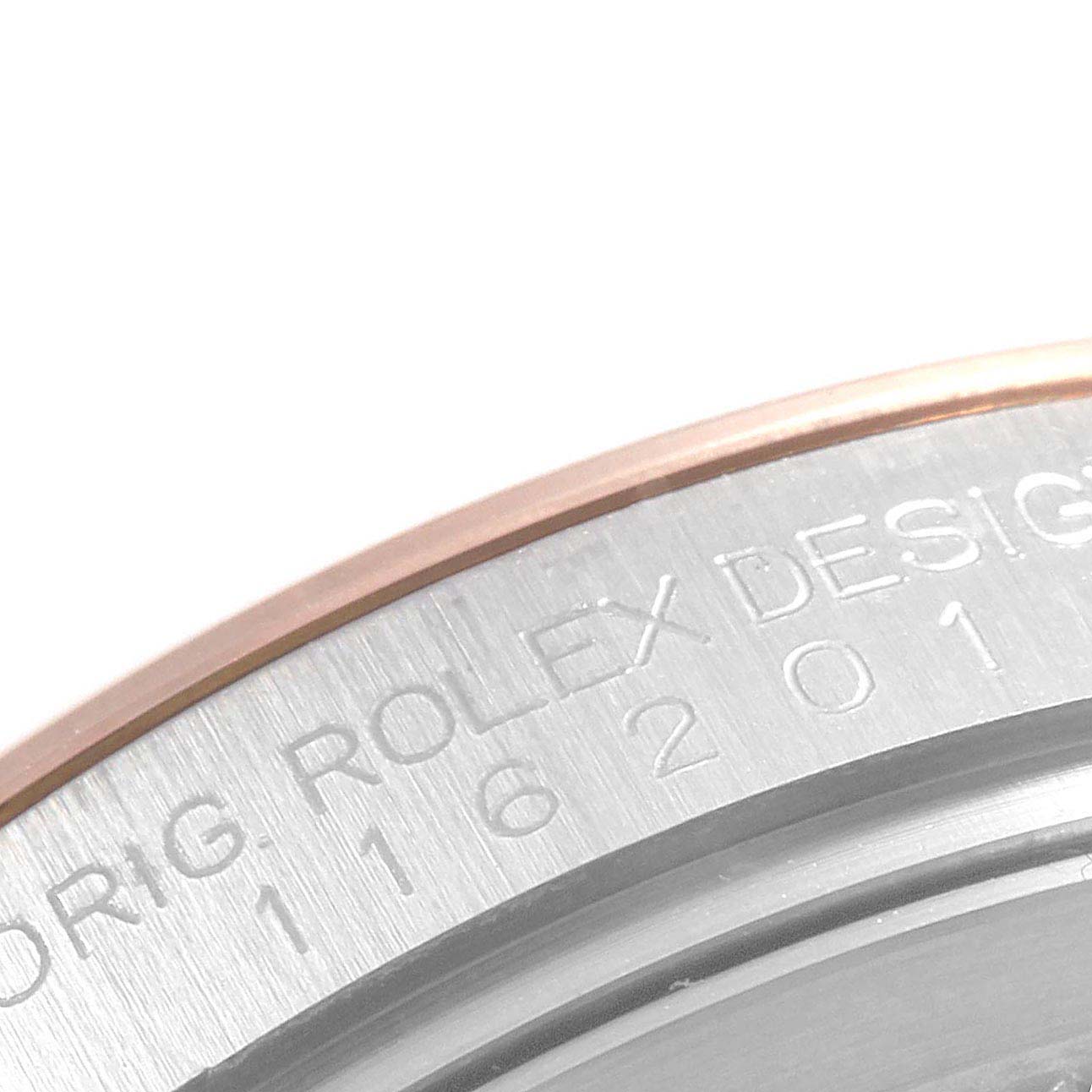 The image shows a close-up of the case rim of a Rolex Datejust 116201 Men
s Rose Gold Black Dial 116201 Men
s Rose Gold Black Dial, with part of the model number and "Rolex Design" engraved.