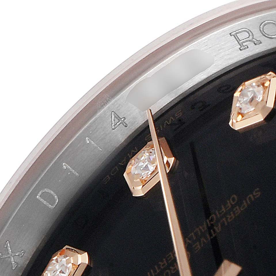 This is a close-up angle of the Rolex Datejust 116201 Men
s Rose Gold Black Dial 116201 Men
s Rose Gold Black Dial, showing parts of the bezel, case, diamond hour markers, and minute hand.