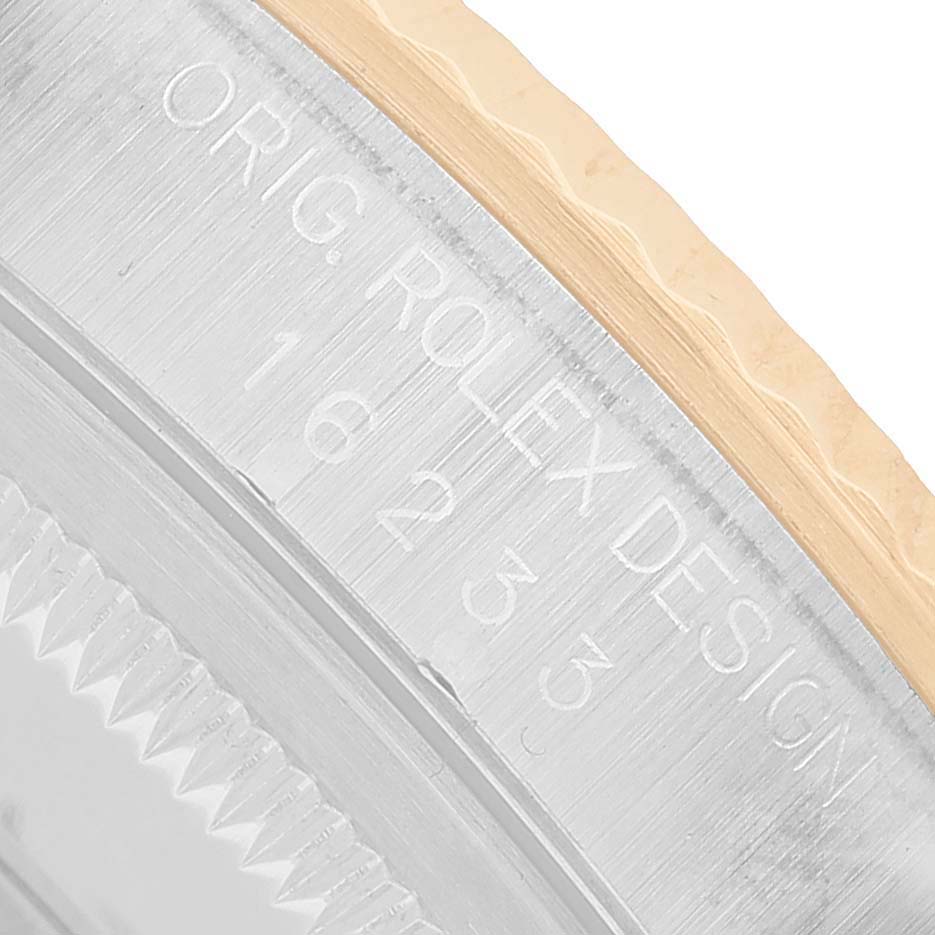 The image shows a close-up of the side case of a Rolex Datejust 16233 Men's Stainless Steel Silver Dial, highlighting the engraving and part of the bezel.