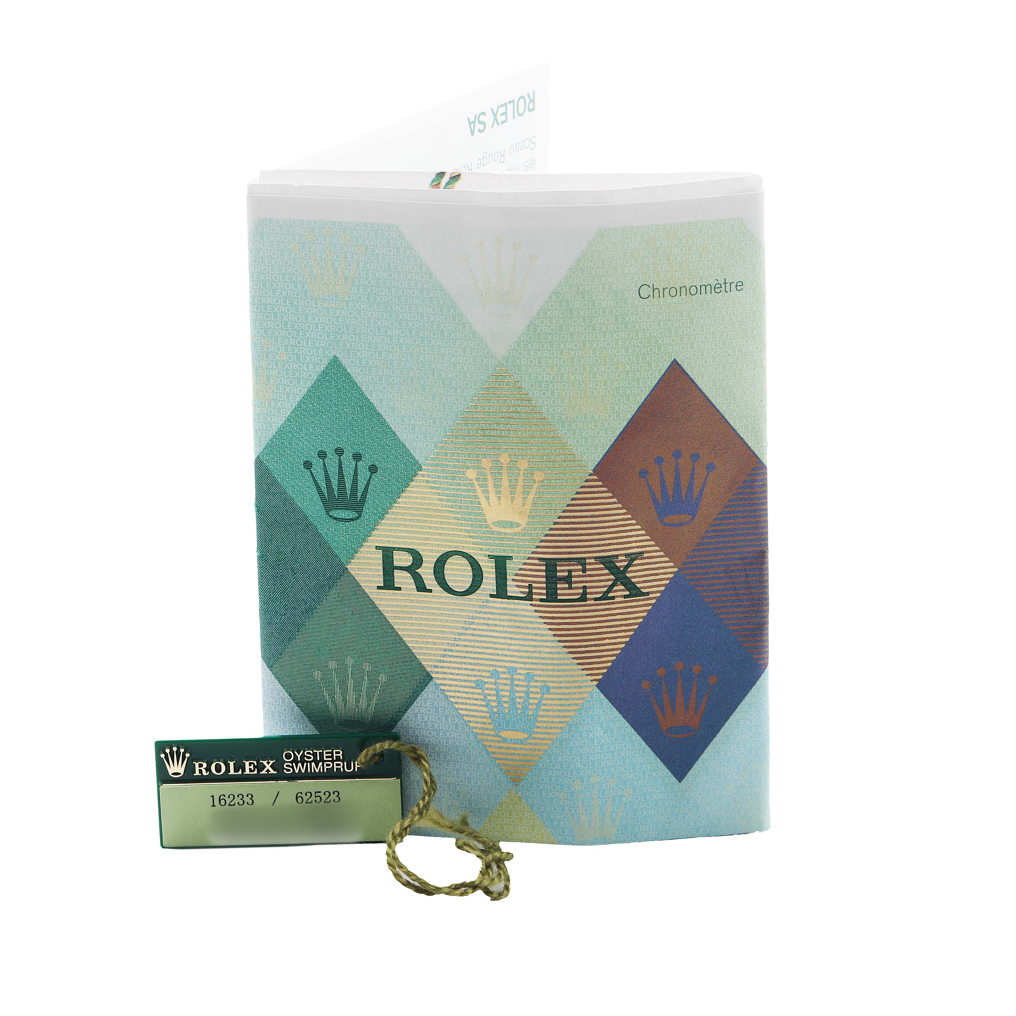 The image shows a Rolex Datejust 16233 Men's Stainless Steel Silver Dial booklet and a green tag with model numbers, viewed from the front.