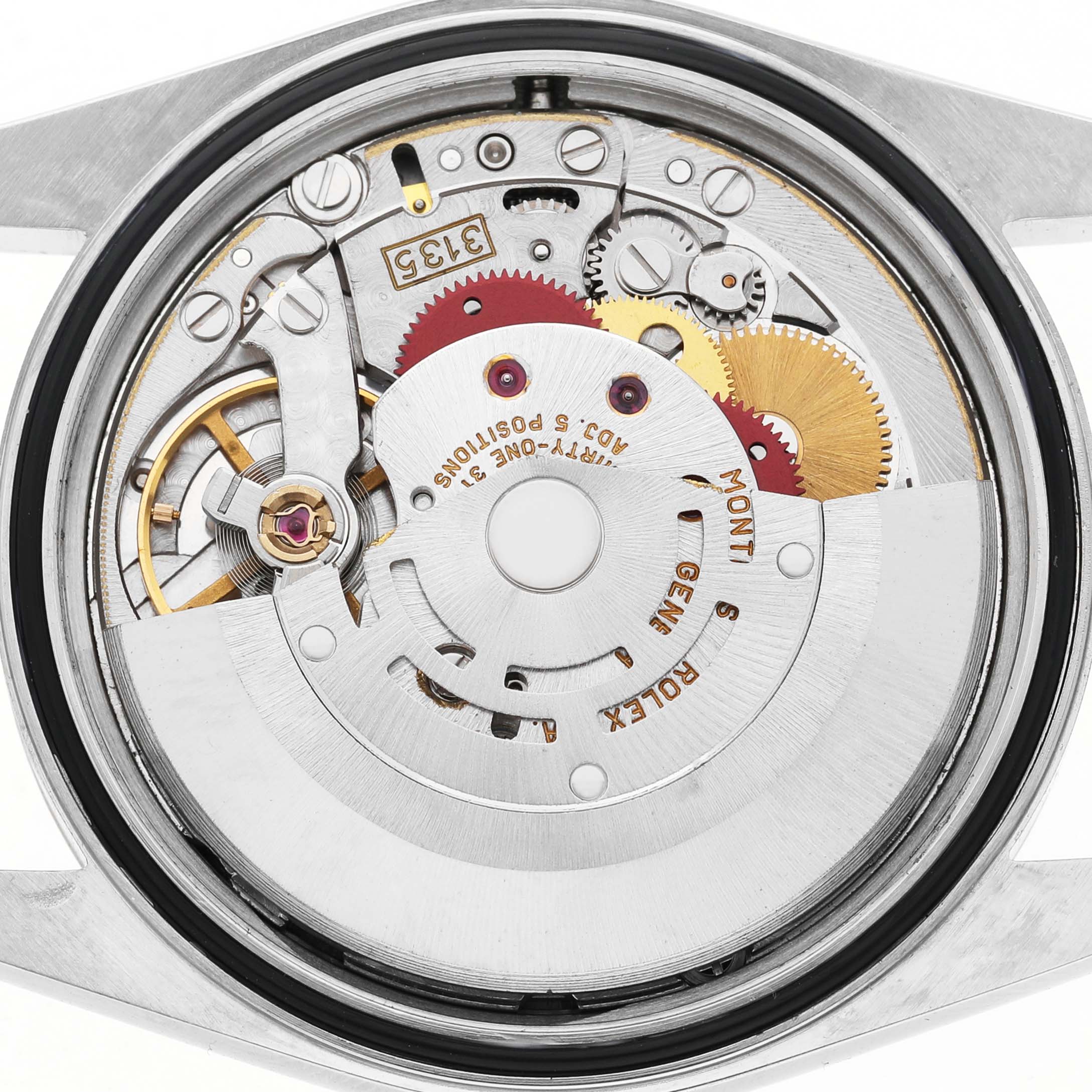 The image shows the Rolex Datejust 16233 Men's Steel and Gold (two tone) Silver Dial's movement from a top-down angle, highlighting gears, cogs, and inner mechanical parts.