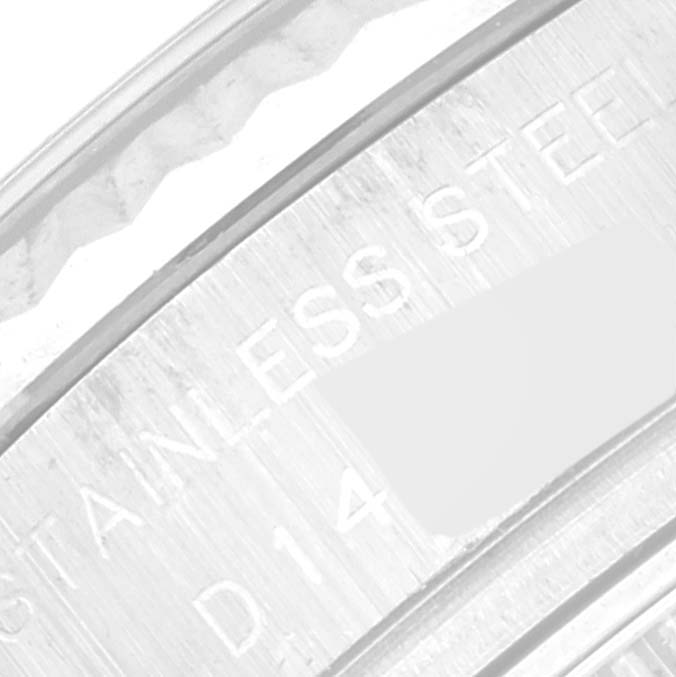 The image shows a close-up of the engraved inner rim of a Rolex Datejust 179174 Women's Stainless Steel Black Dial 179174 Women's Stainless Steel Black Dial stainless steel case.