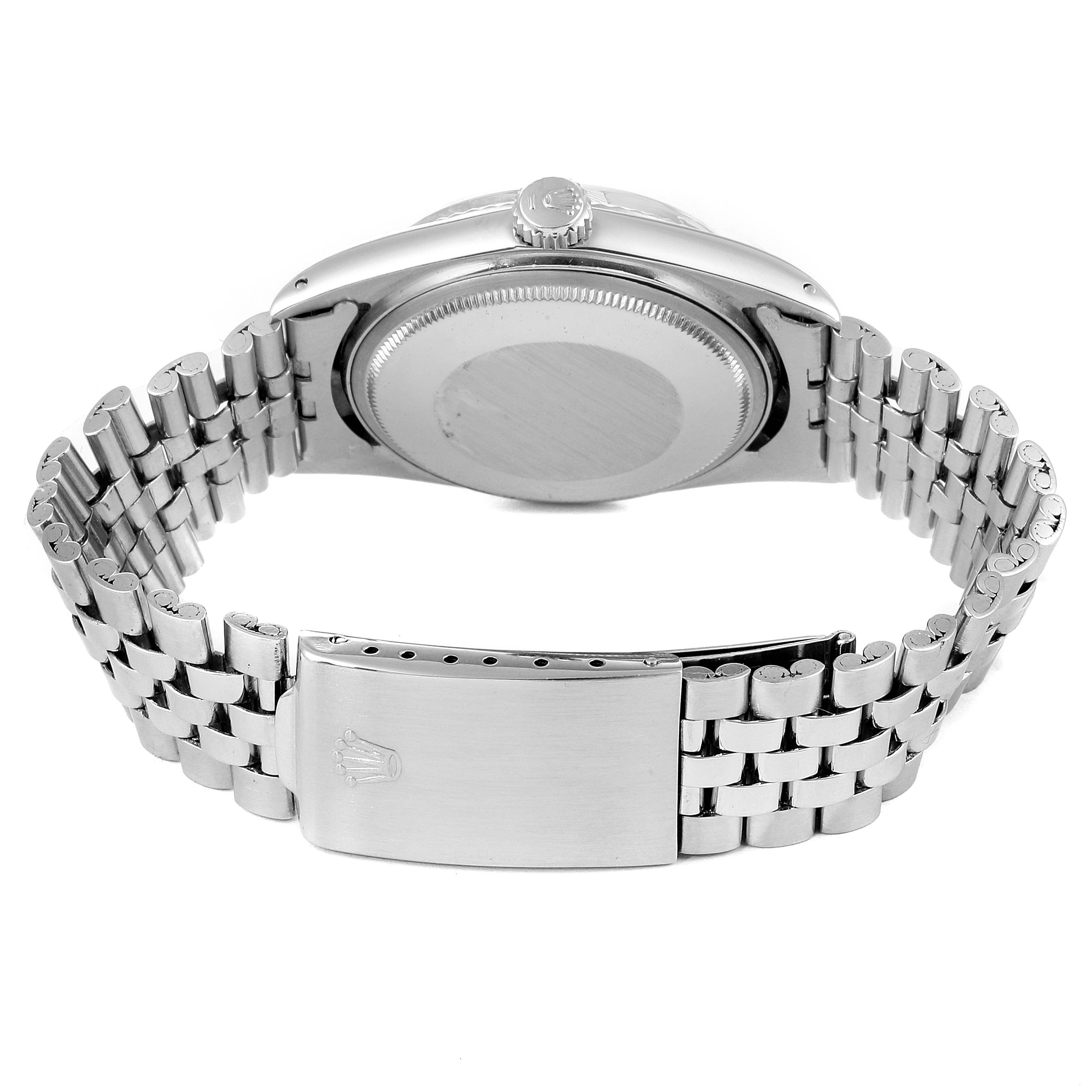 This image shows the back case, crown, and bracelet clasp of a Rolex Vintage Collection 1601 Men
s Stainless Steel Silver Dial 1601 Men
s Stainless Steel Silver Dial model watch.