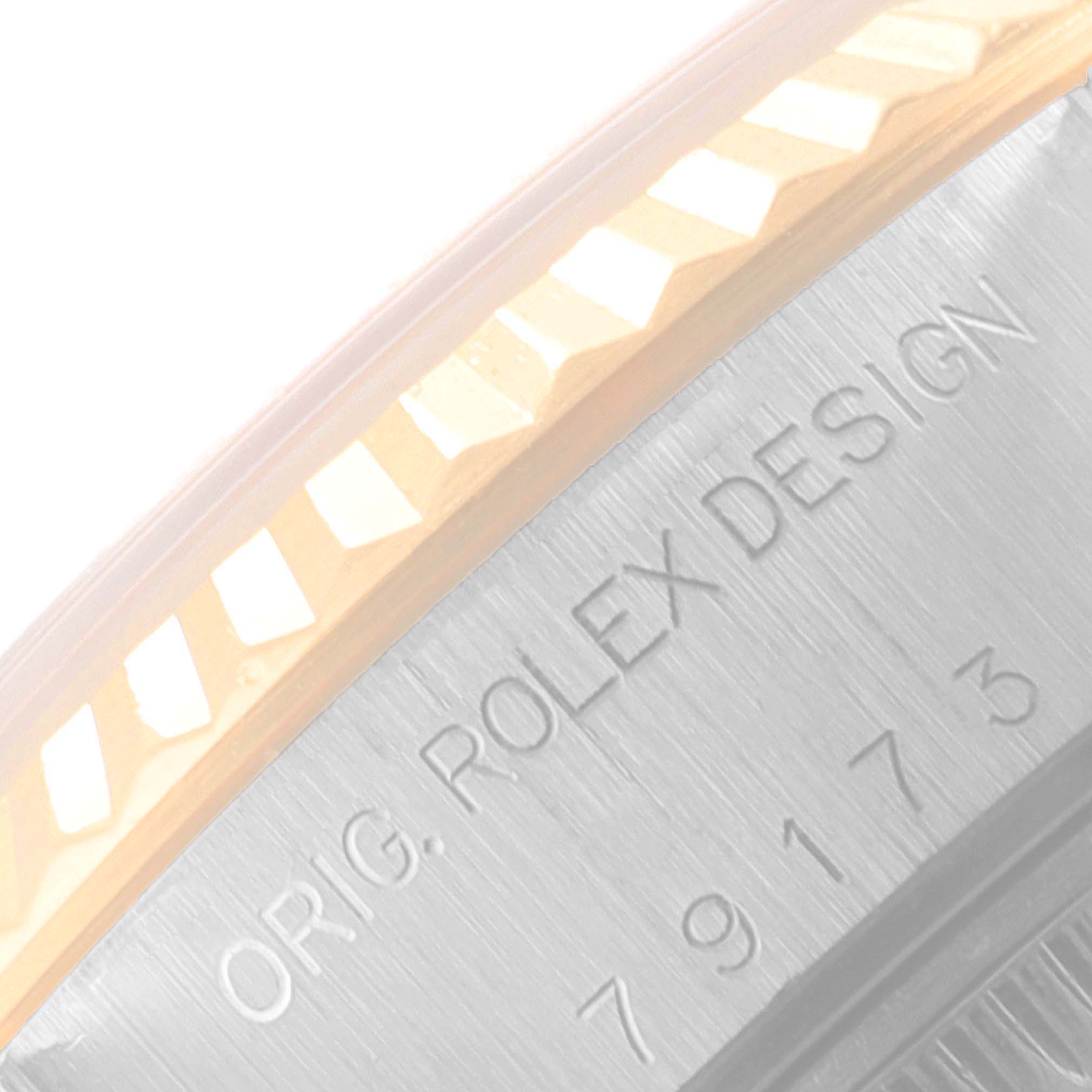 The image shows a close-up of the Rolex Datejust 79173 Women
s Steel and Gold (two tone) Champagne Dial 79173 Women
s Steel and Gold (two tone) Champagne Dial bezel and case engraving, highlighting the "ORIG. ROLEX DESIGN" text and serial number.