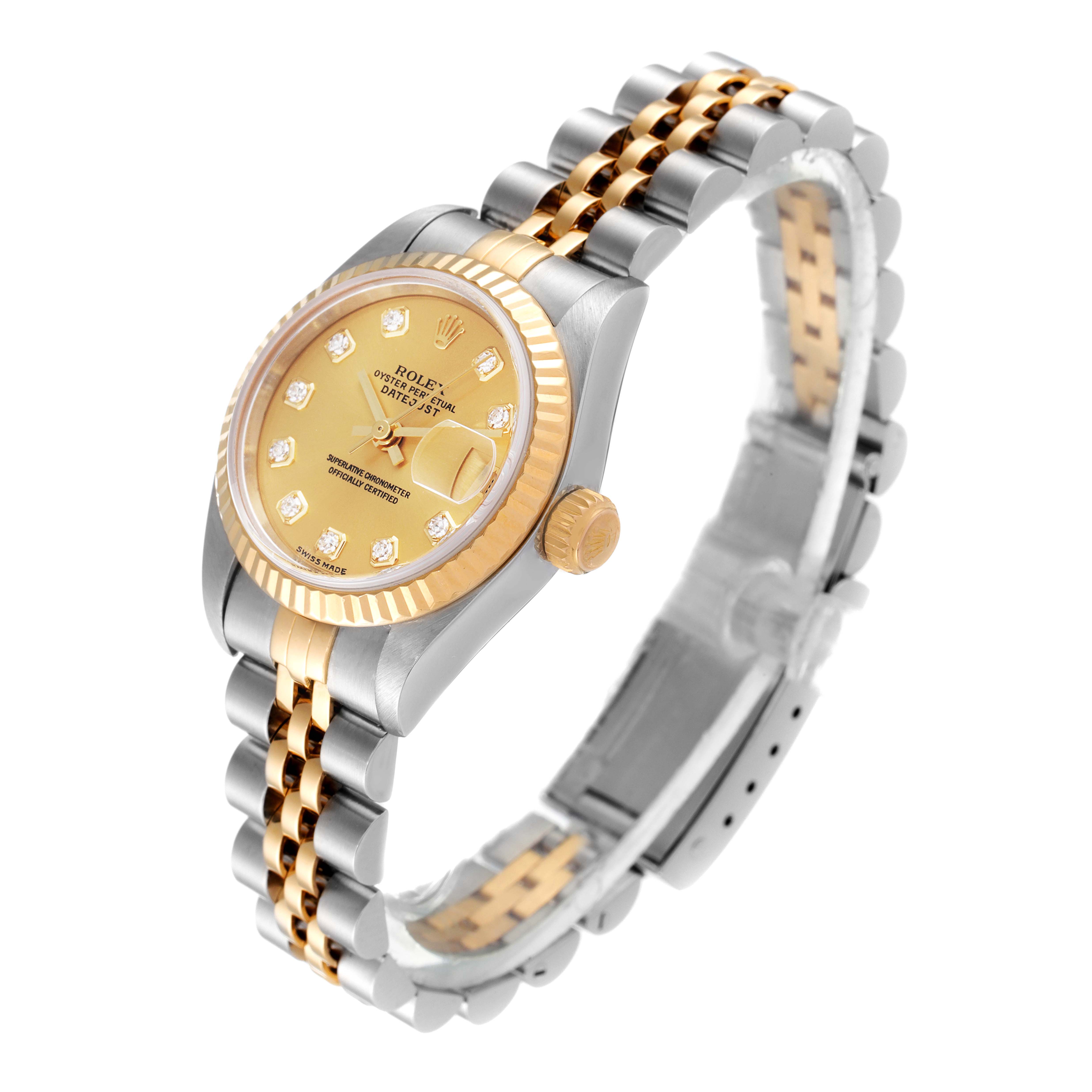 The image shows a Rolex Datejust 79173 Women
s Steel and Gold (two tone) Champagne Dial 79173 Women
s Steel and Gold (two tone) Champagne Dial watch angled slightly from the top, highlighting its two-tone bracelet, bezel, and dial.