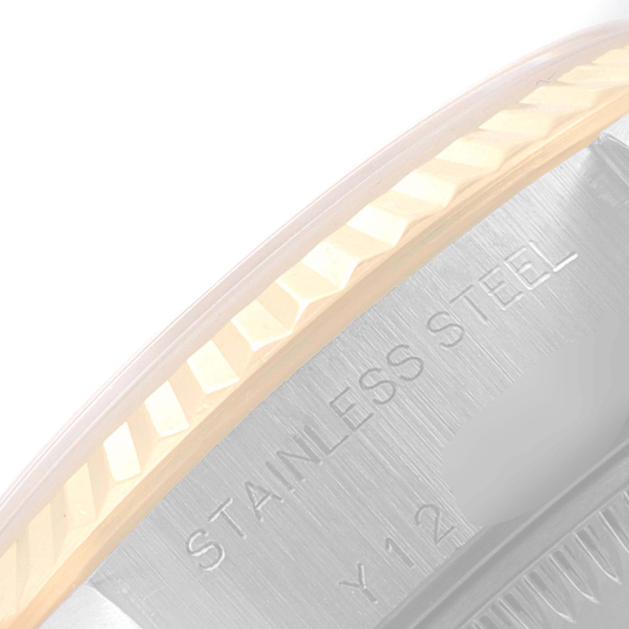 This image shows a close-up of the stainless steel case side and fluted bezel of a Rolex Datejust 79173 Women
s Steel and Gold (two tone) Champagne Dial 79173 Women
s Steel and Gold (two tone) Champagne Dial watch.