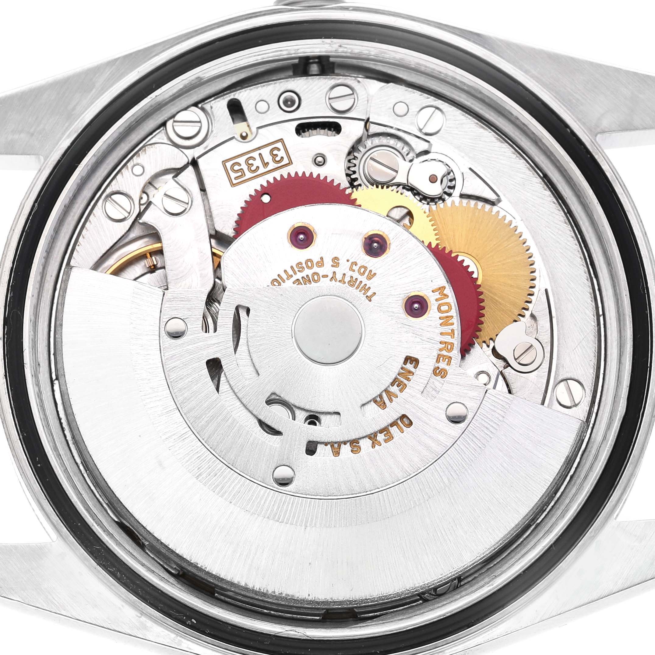 The image shows the intricate movement mechanism of a Rolex Datejust 16233 Men's Steel and Gold (two tone) Champagne Dial from a top-down angle.