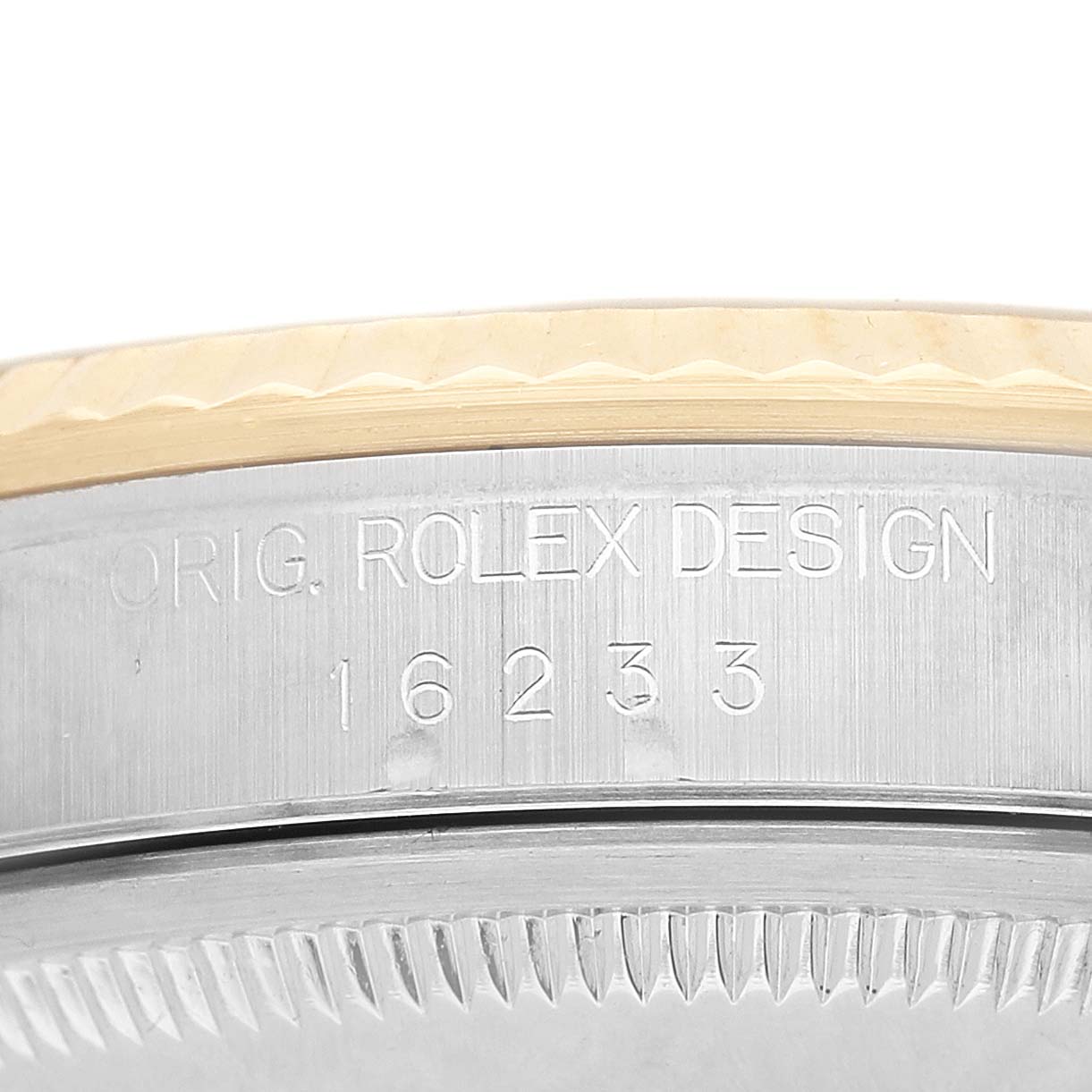 The image shows an angled close-up of the Rolex Datejust 16233 Men's Steel and Gold (two tone) Champagne Dial case side, highlighting the model and serial engraving.