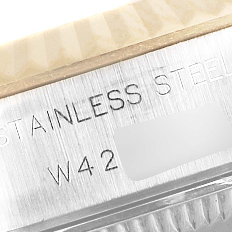 The close-up angle shows the side of the Rolex Datejust 69173 Women's Steel and Gold (two tone) Champagne Dial 69173 Women's Steel and Gold (two tone) Champagne Dial, highlighting the "STAINLESS STEEL" inscription.