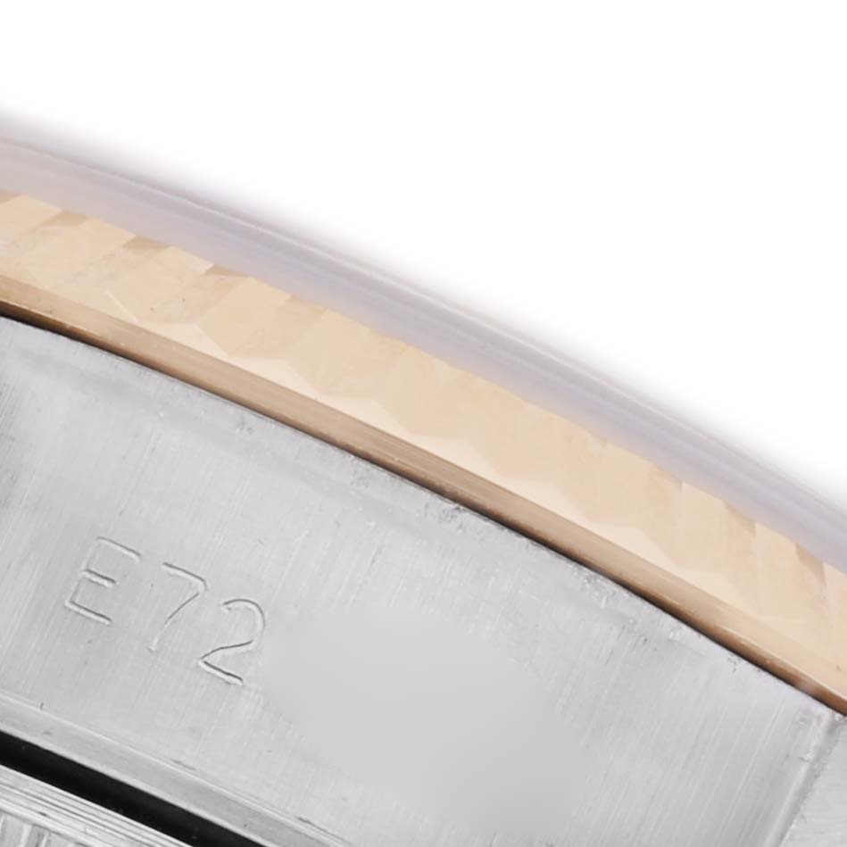 The image shows a close-up angle of the bezel and part of the case with an engraved code of the Rolex Datejust 69173 Women's Steel and Gold (two tone) White Dial 69173 Women's Steel and Gold (two tone) White Dial.