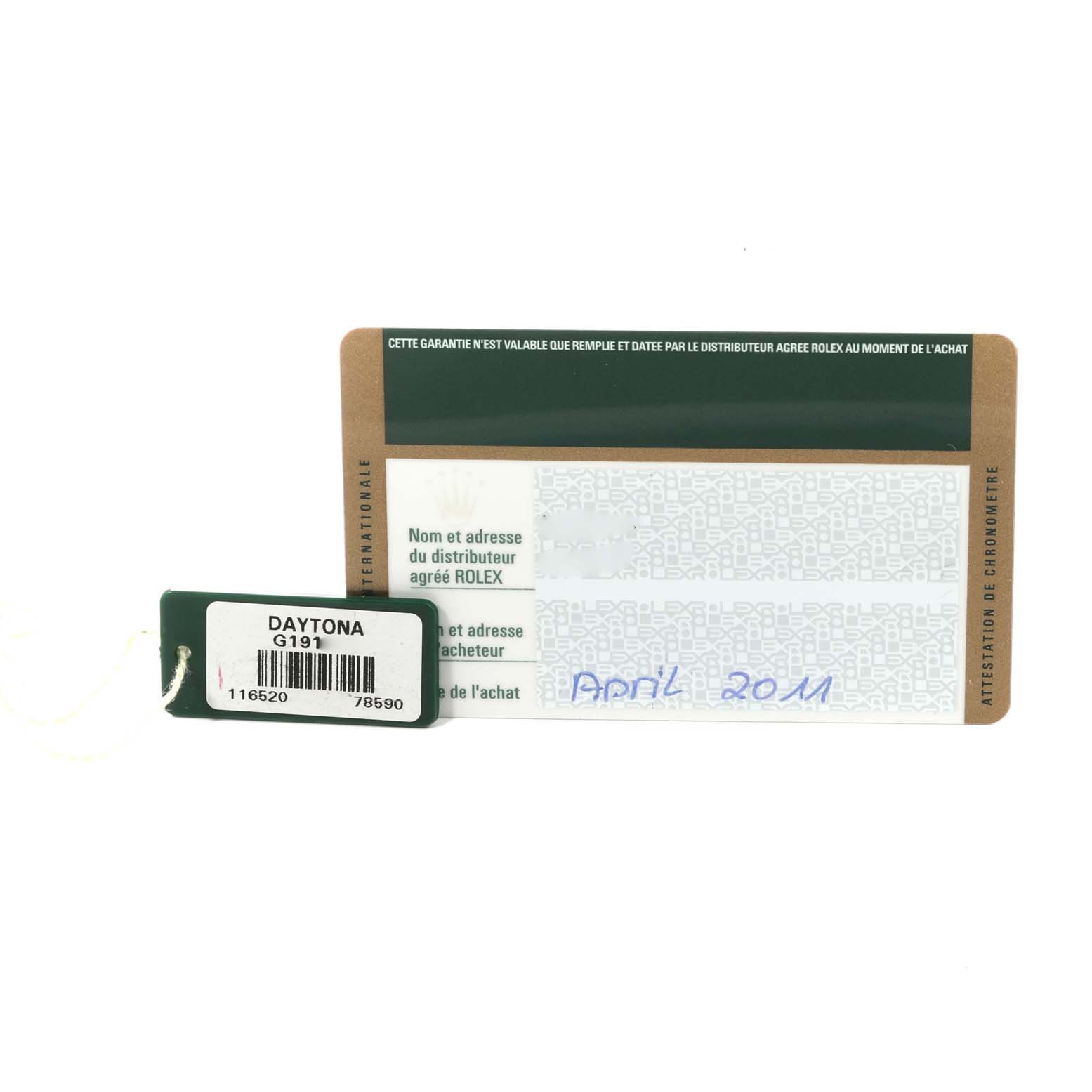 The image shows a Rolex Daytona 116520 Men's Stainless Steel Black Dial 116520 Men's Stainless Steel Black Dial tag and an international warranty card from the front angle.