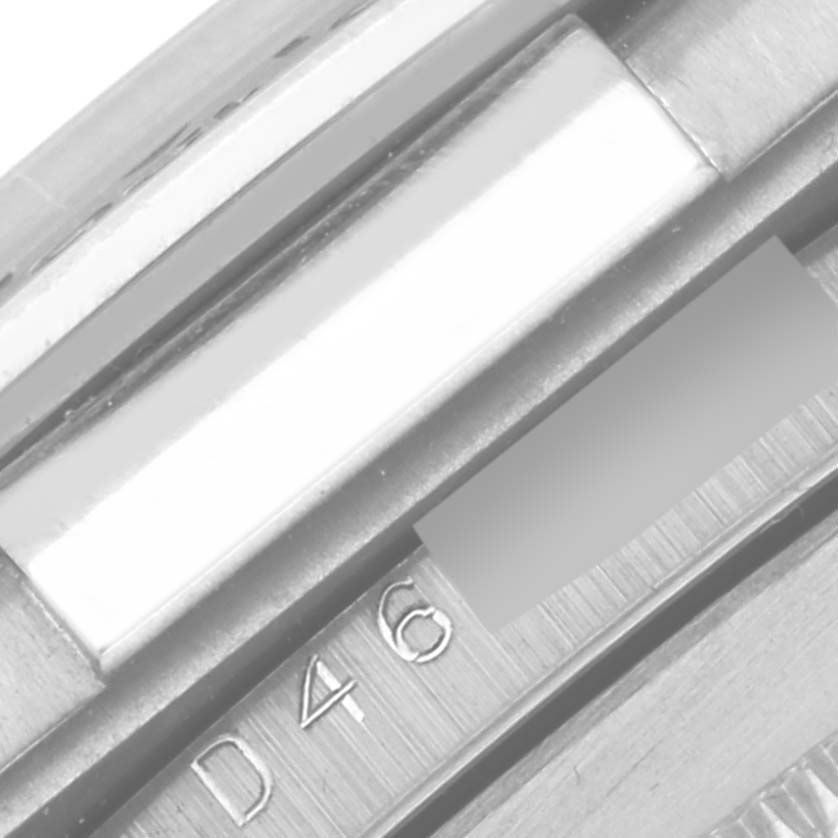 The image shows a close-up of the Rolex Daytona 116519 Men's White Gold White Dial 116519 Men's White Gold White Dial model's bracelet or clasp, highlighting the engraved serial or model number.