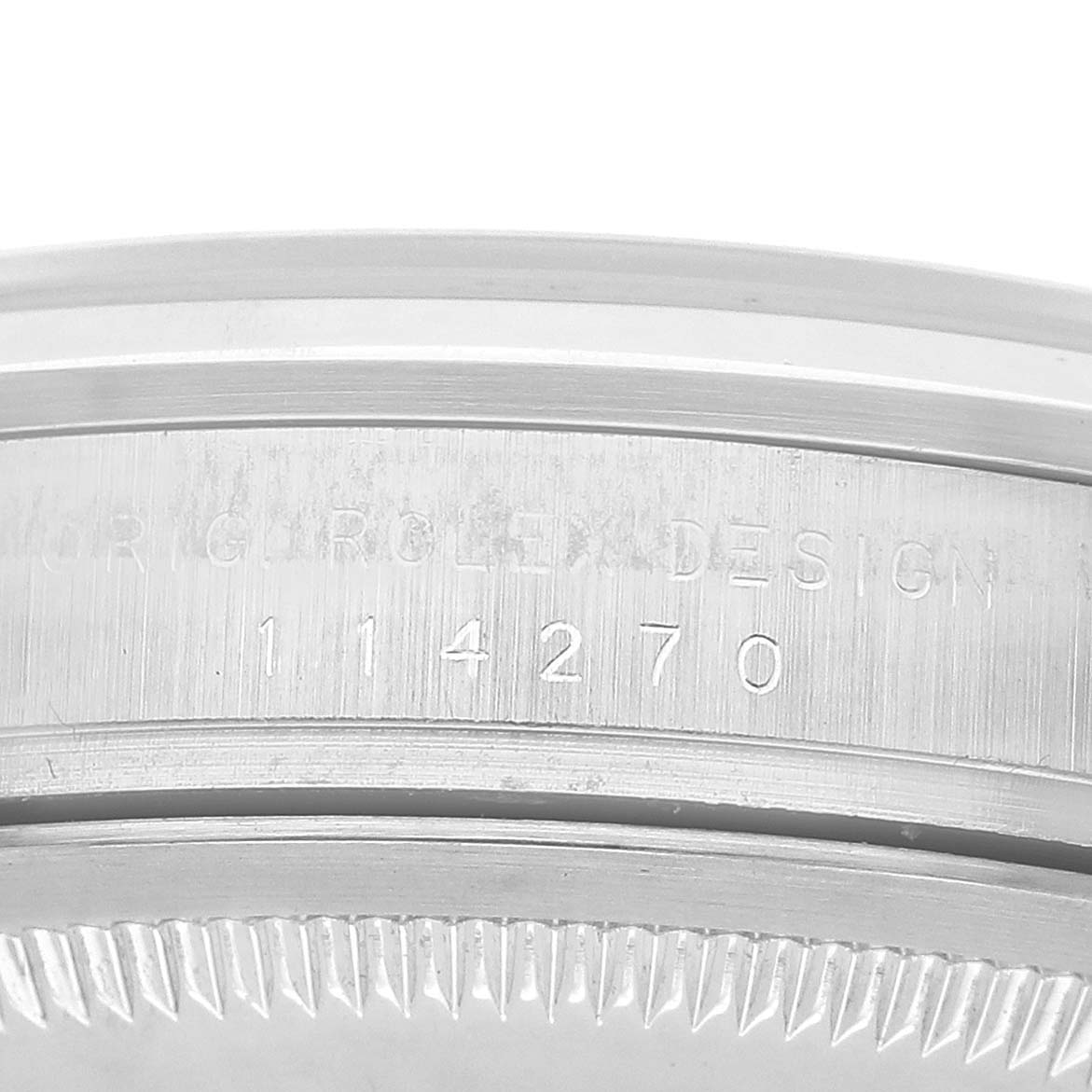 The image shows a close-up of the model number engraving on the side of the Rolex Explorer 114270 Men's Stainless Steel Black Dial watch case.