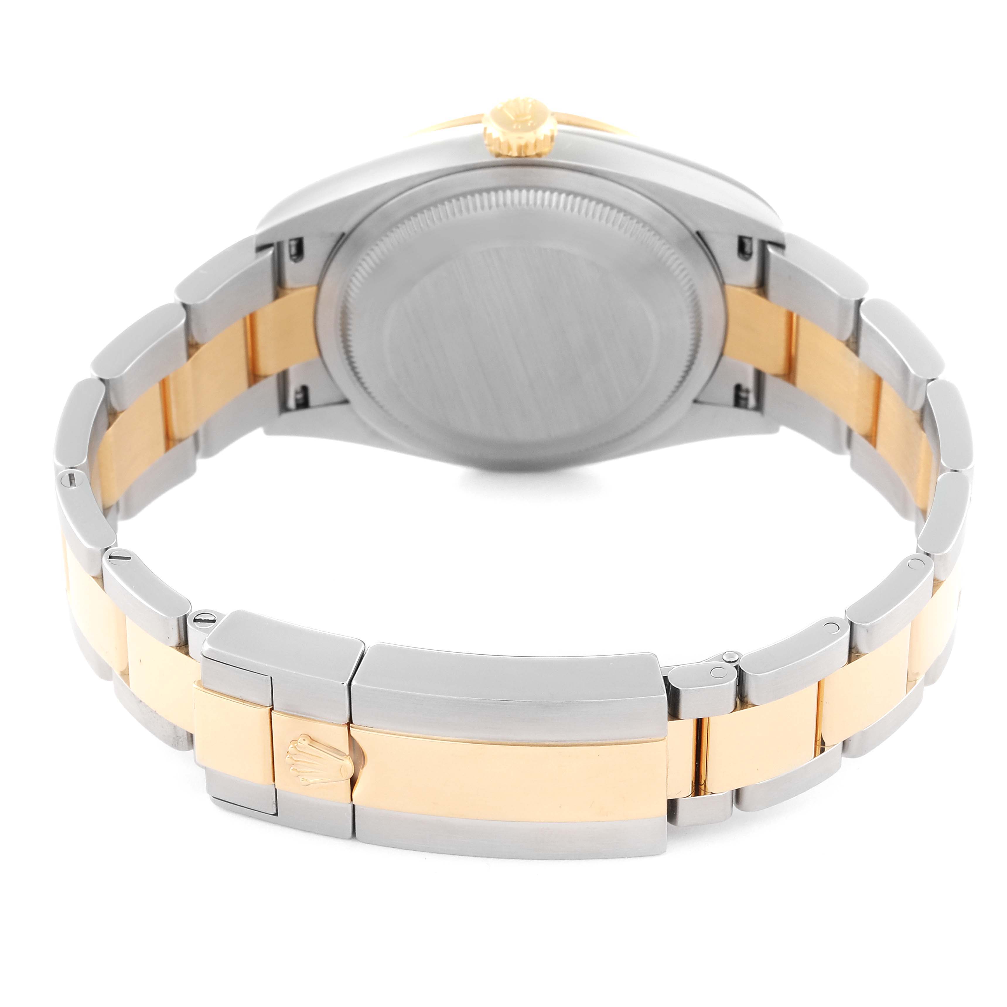 The image shows the back view of a Rolex Explorer 124273 Men
s Steel and Gold (two tone) Black Dial 124273 Men
s Steel and Gold (two tone) Black Dial watch, focusing on the caseback and two-tone bracelet clasp.