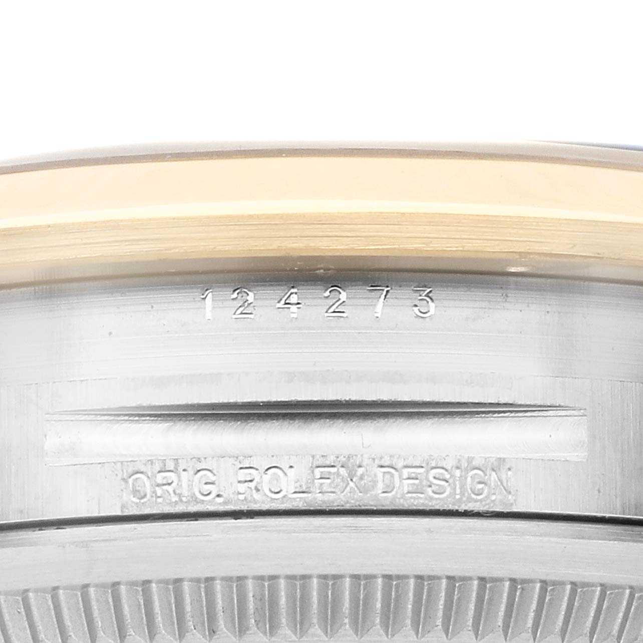 The image shows a close-up of the case side of a Rolex Explorer 124273 Men
s Steel and Gold (two tone) Black Dial 124273 Men
s Steel and Gold (two tone) Black Dial watch, highlighting its serial and model numbers.