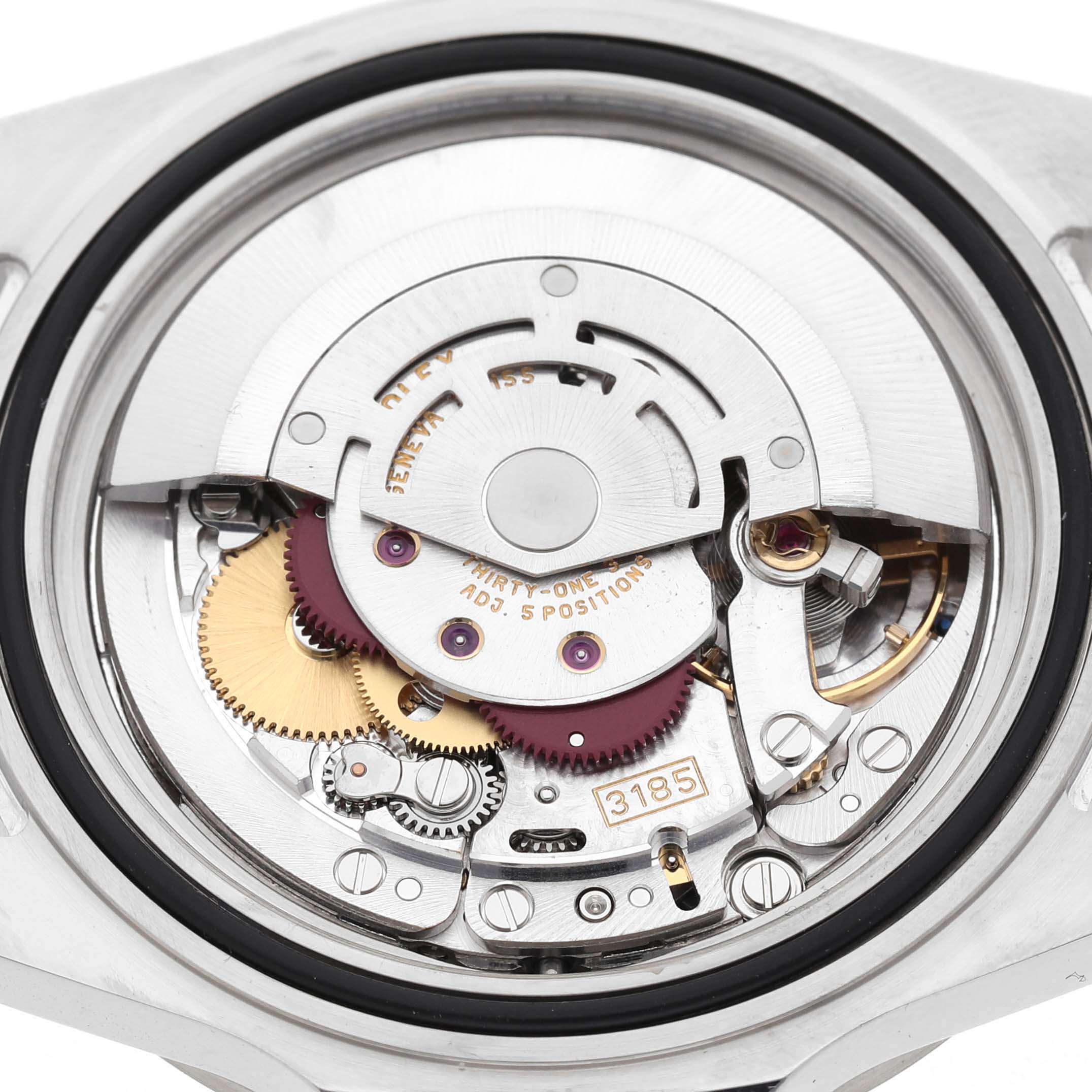 The image shows the Rolex Explorer 16570 Men's Stainless Steel White Dial's movement from the back, highlighting gears and components of the automatic mechanism.
