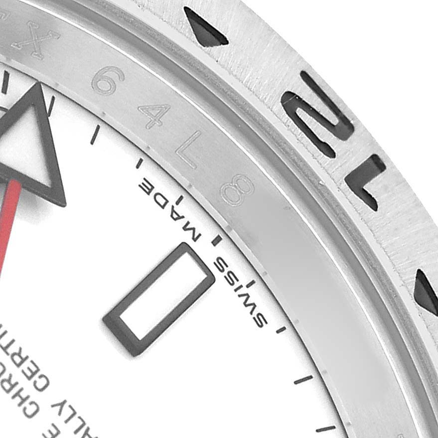 The image shows a close-up of the dial's edge and part of the bezel of a Rolex Explorer 16570 Men's Stainless Steel White Dial watch, highlighting the "Swiss Made" text.