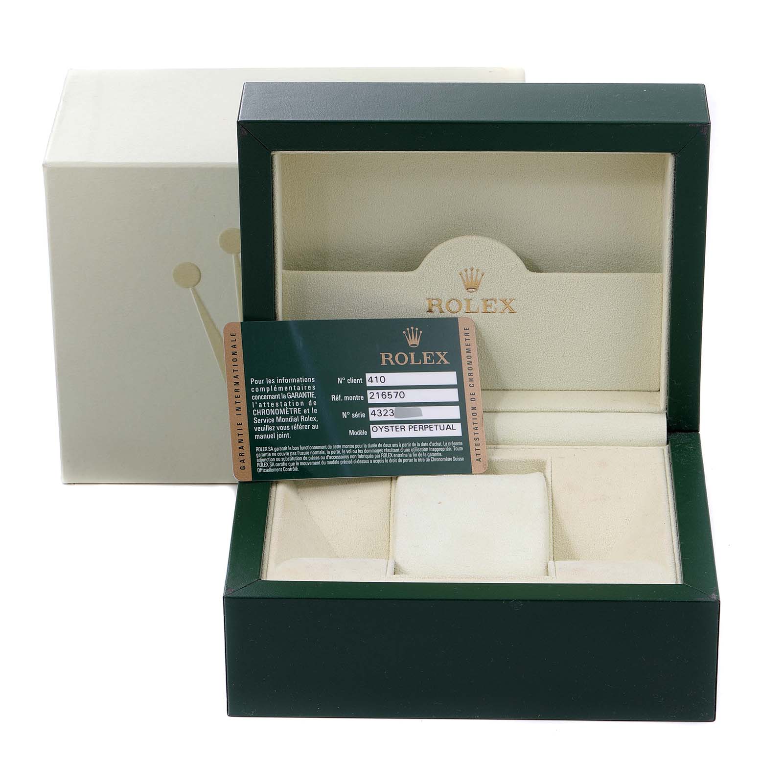 This image shows the open watch box and warranty card for a Rolex Explorer 216570 Men's Stainless Steel White Dial 216570 Men's Stainless Steel White Dial model.