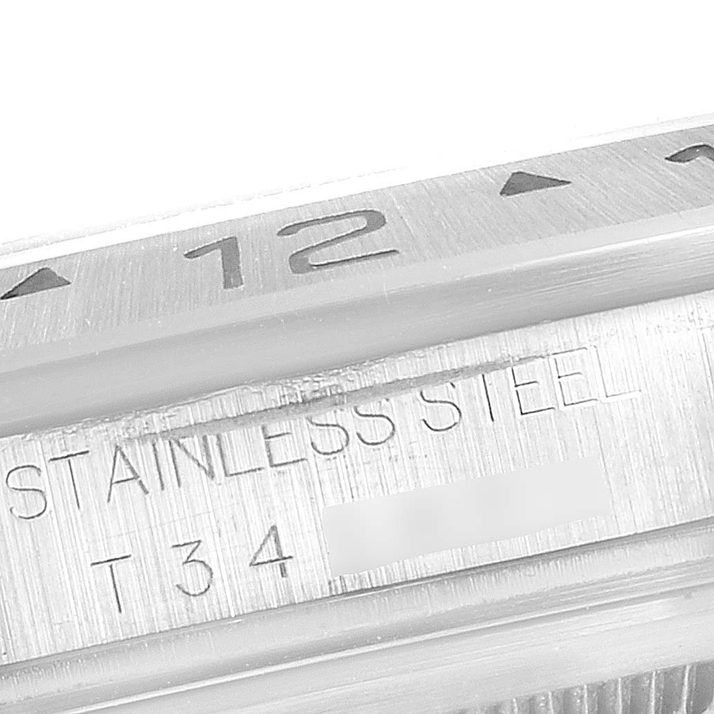 This image shows a close-up of the bezel and serial number on a Rolex Explorer 16570 Men
s Stainless Steel Black Dial 16570 Men
s Stainless Steel Black Dial model watch.