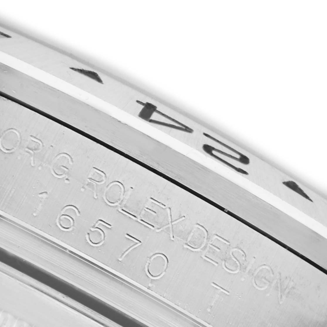 The image shows a close-up of the Rolex Explorer 16570 Men's Stainless Steel Black Dial 16570 Men's Stainless Steel Black Dial's bezel and engraved side, focusing on design details.