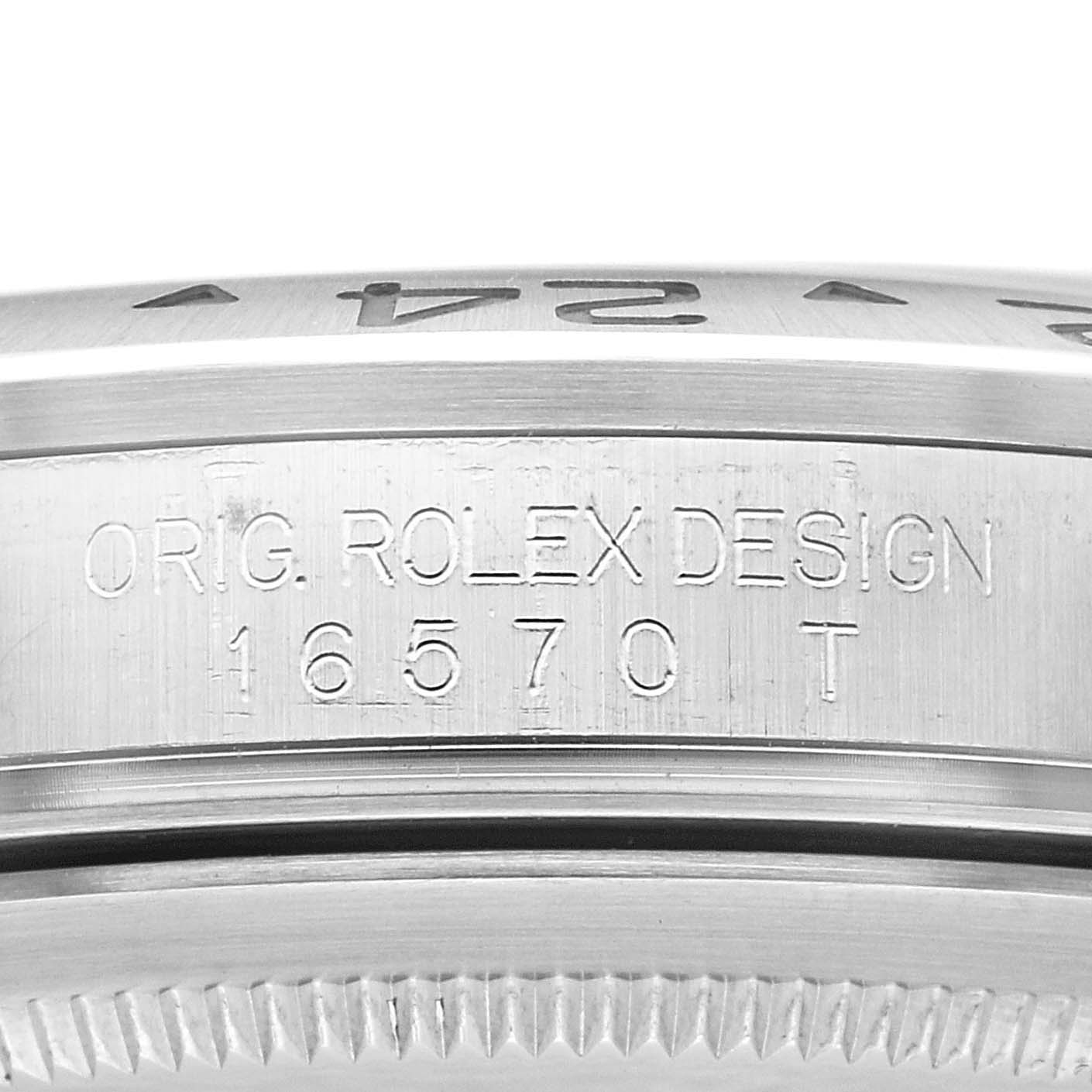 The image shows an angled close-up of the engraved bezel and case side of the Rolex Explorer 16570T Men
s Stainless Steel White Dial 16570T Men
s Stainless Steel White Dial model 16570.