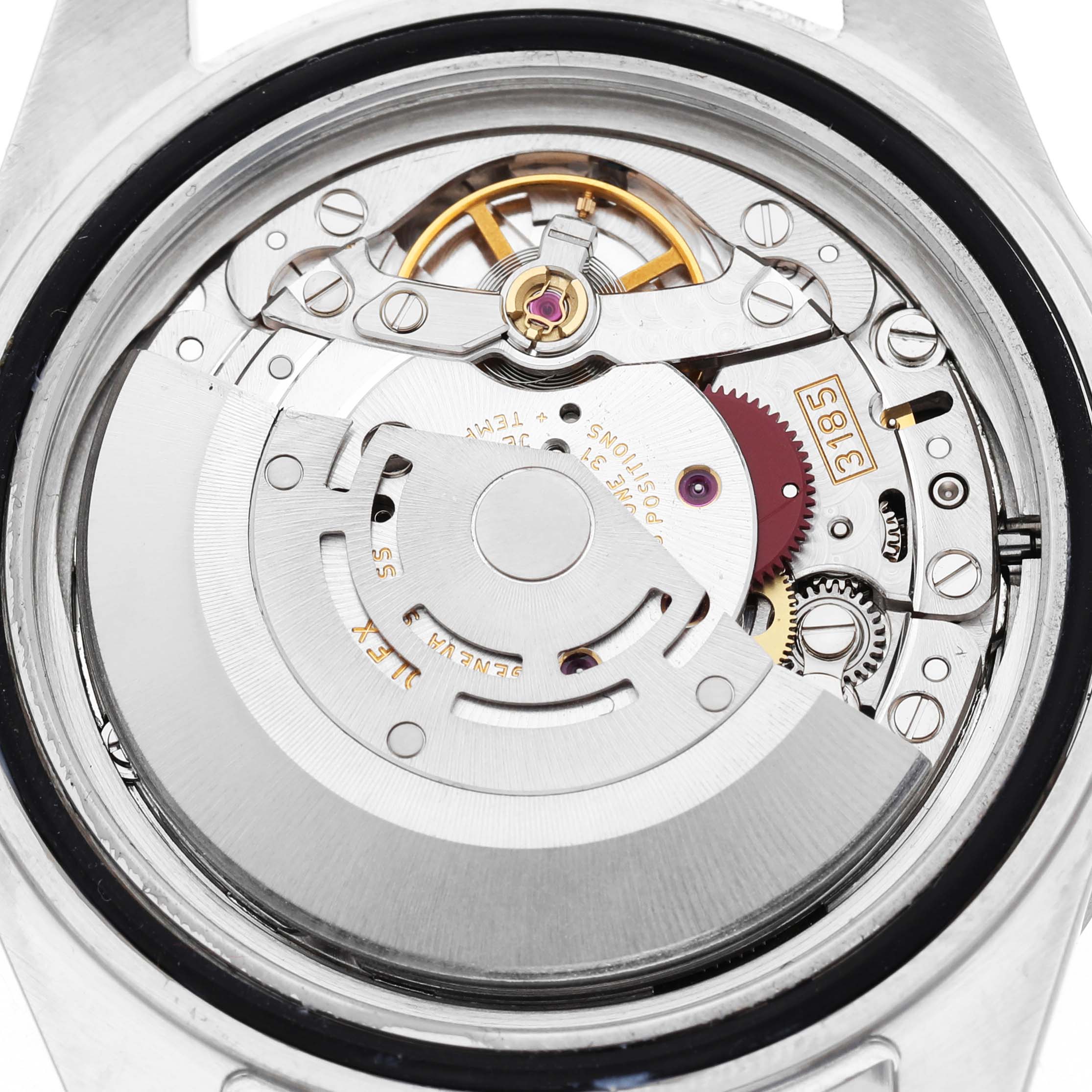 The image shows a close-up of the Rolex Explorer 16570 Men's Stainless Steel Black Dial's movement from the back, highlighting the rotor and internal components.