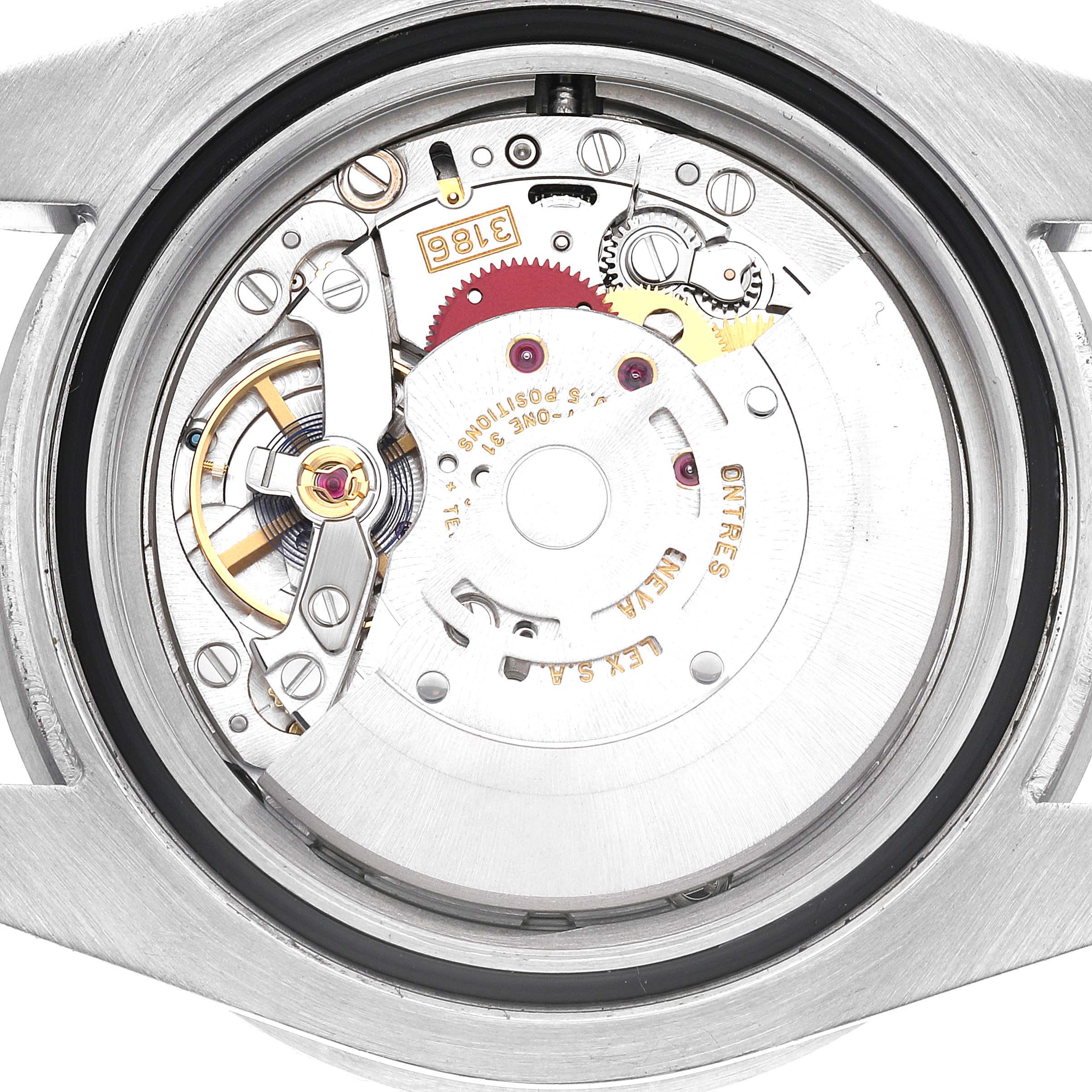 The image shows an internal view of the movement mechanism of a Rolex GMT-Master 116710LN Men's Stainless Steel Black Dial 116710LN Men's Stainless Steel Black Dial watch.