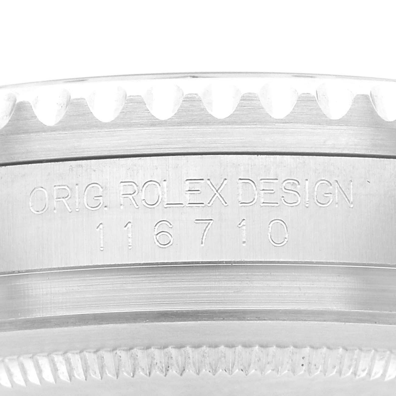 This close-up image shows the side view of the casing of a Rolex GMT-Master 116710LN Men's Stainless Steel Black Dial 116710LN Men's Stainless Steel Black Dial watch with engraved model number 116710.