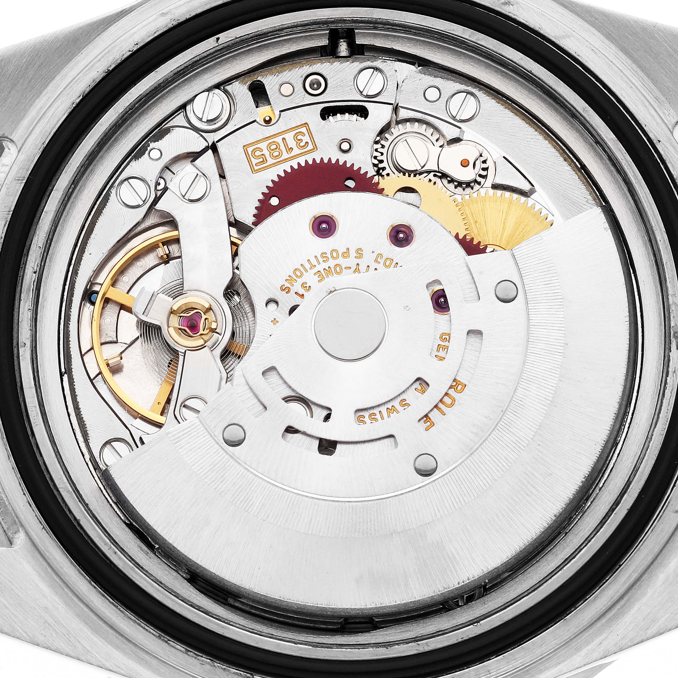 The image shows the movement of a Rolex GMT-Master 16710 Men
s Stainless Steel Black Dial 16710 Men
s Stainless Steel Black Dial watch from a rear angle, highlighting gears and the oscillating weight.