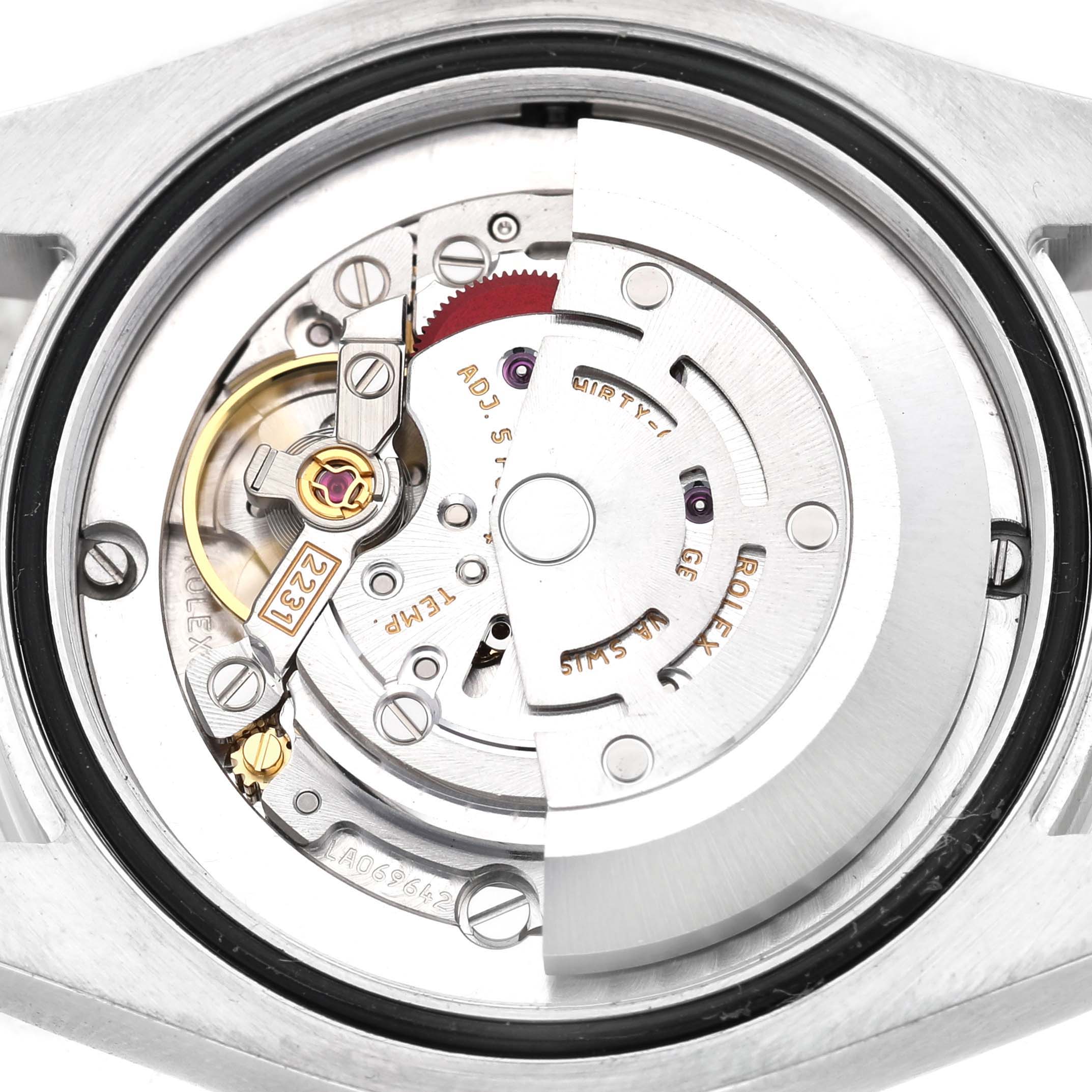 The image shows the movement mechanism of a Rolex Oyster Perpetual 177200 Women's Stainless Steel Purple Dial watch from the back angle, highlighting the rotor and gears.
