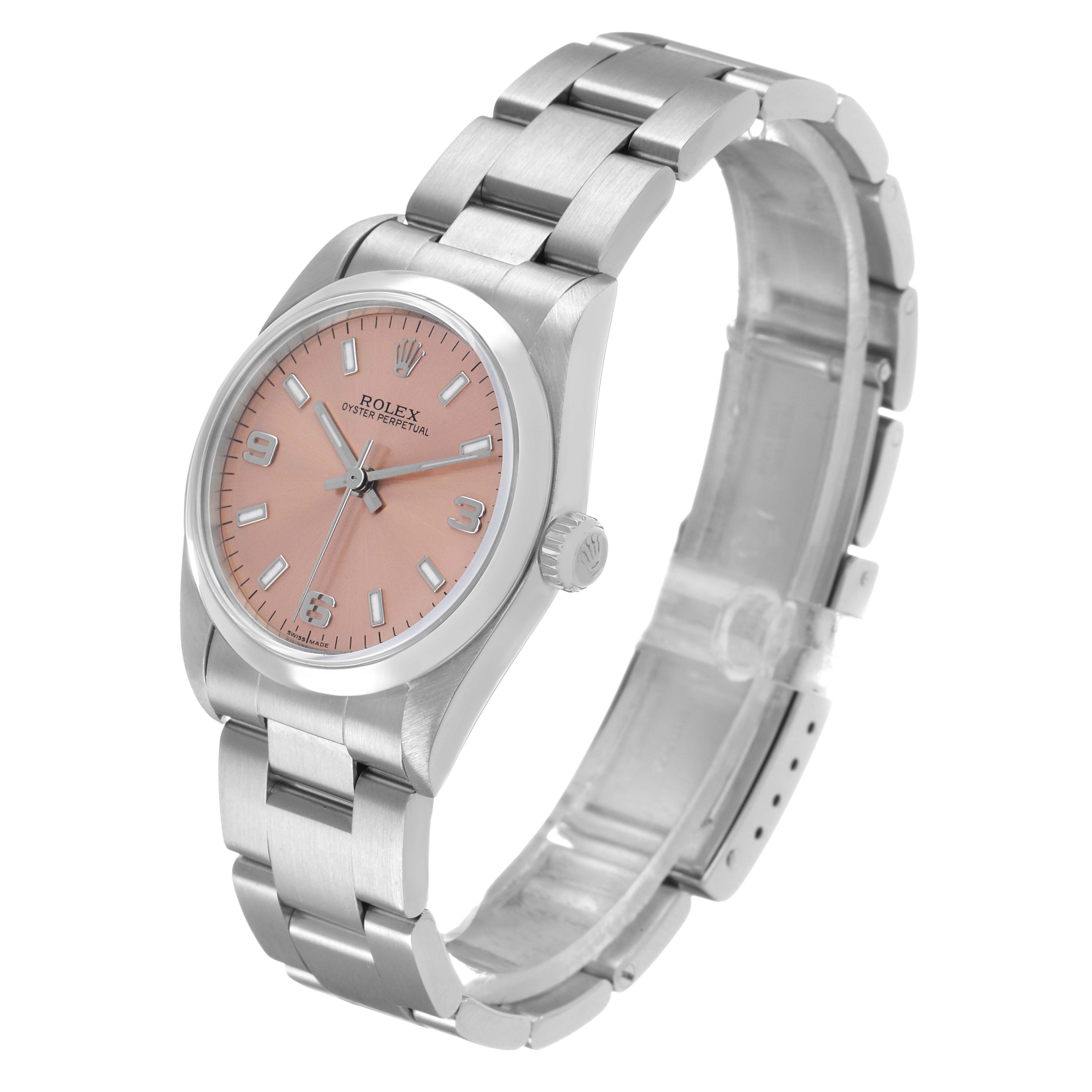 The Rolex Oyster Perpetual 77080 Women's Stainless Steel Pink Dial watch is shown at a slight angle, displaying the dial, case, crown, and part of the bracelet.