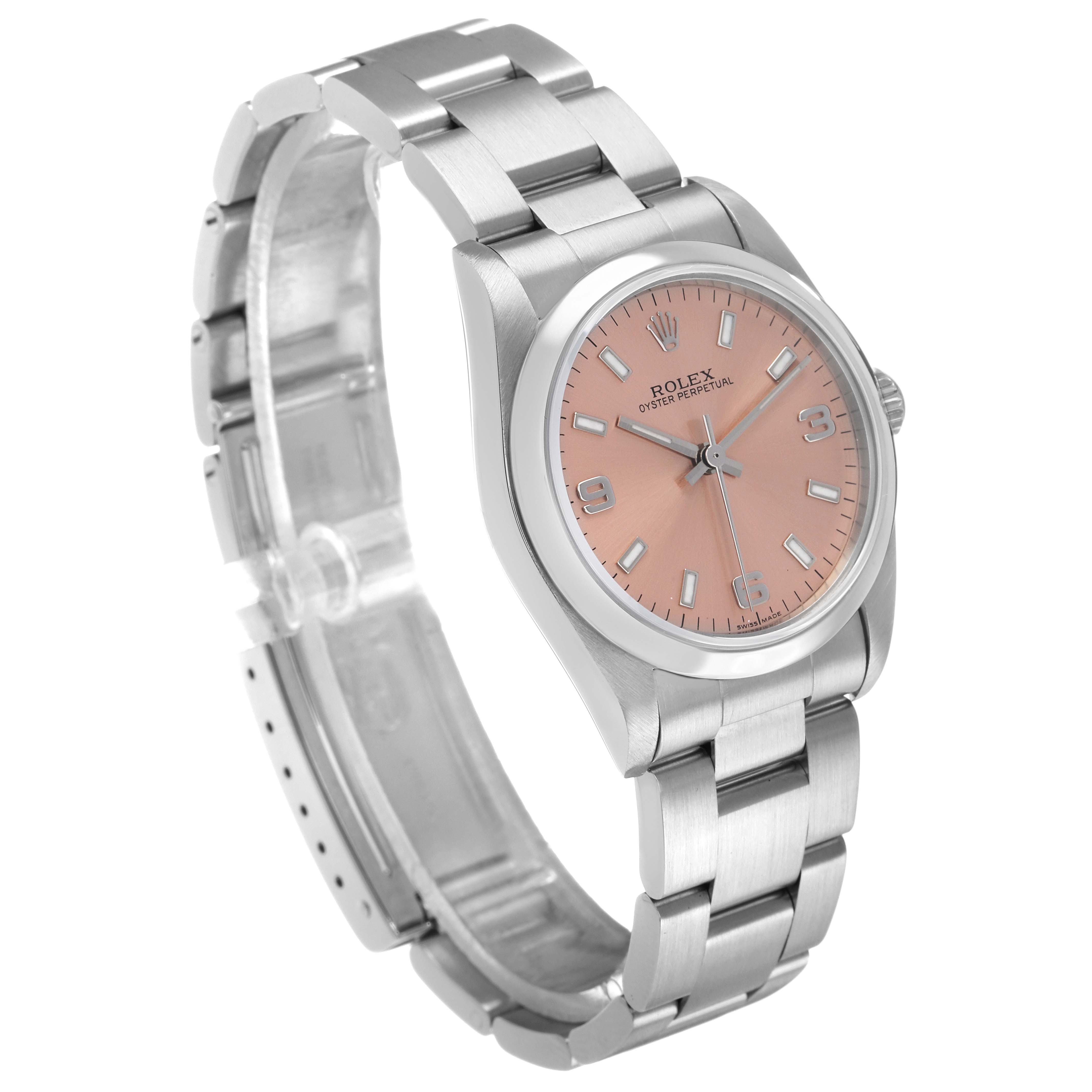 The Rolex Oyster Perpetual 77080 Women's Stainless Steel Pink Dial watch is shown at a three-quarter angle, highlighting the face, bezel, and partial bracelet.