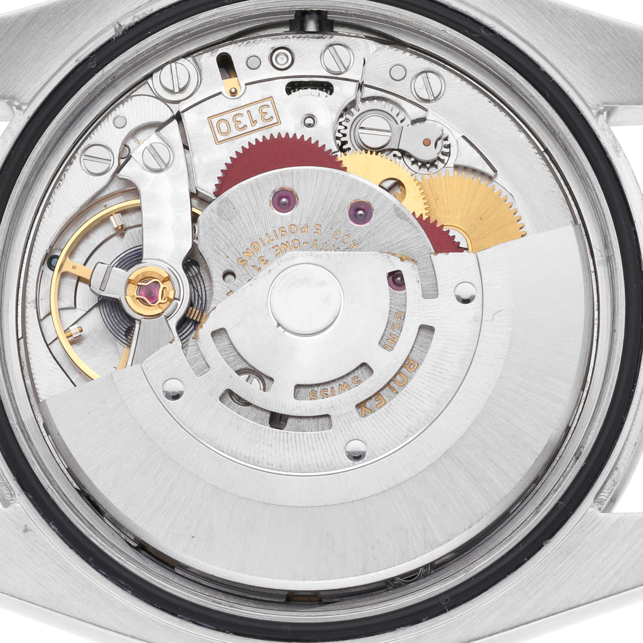 The image shows the inner mechanical movement of a Rolex Oyster Perpetual 116000 Men
s Stainless Steel Black Dial 116000 Men
s Stainless Steel Black Dial watch, viewed from the back.