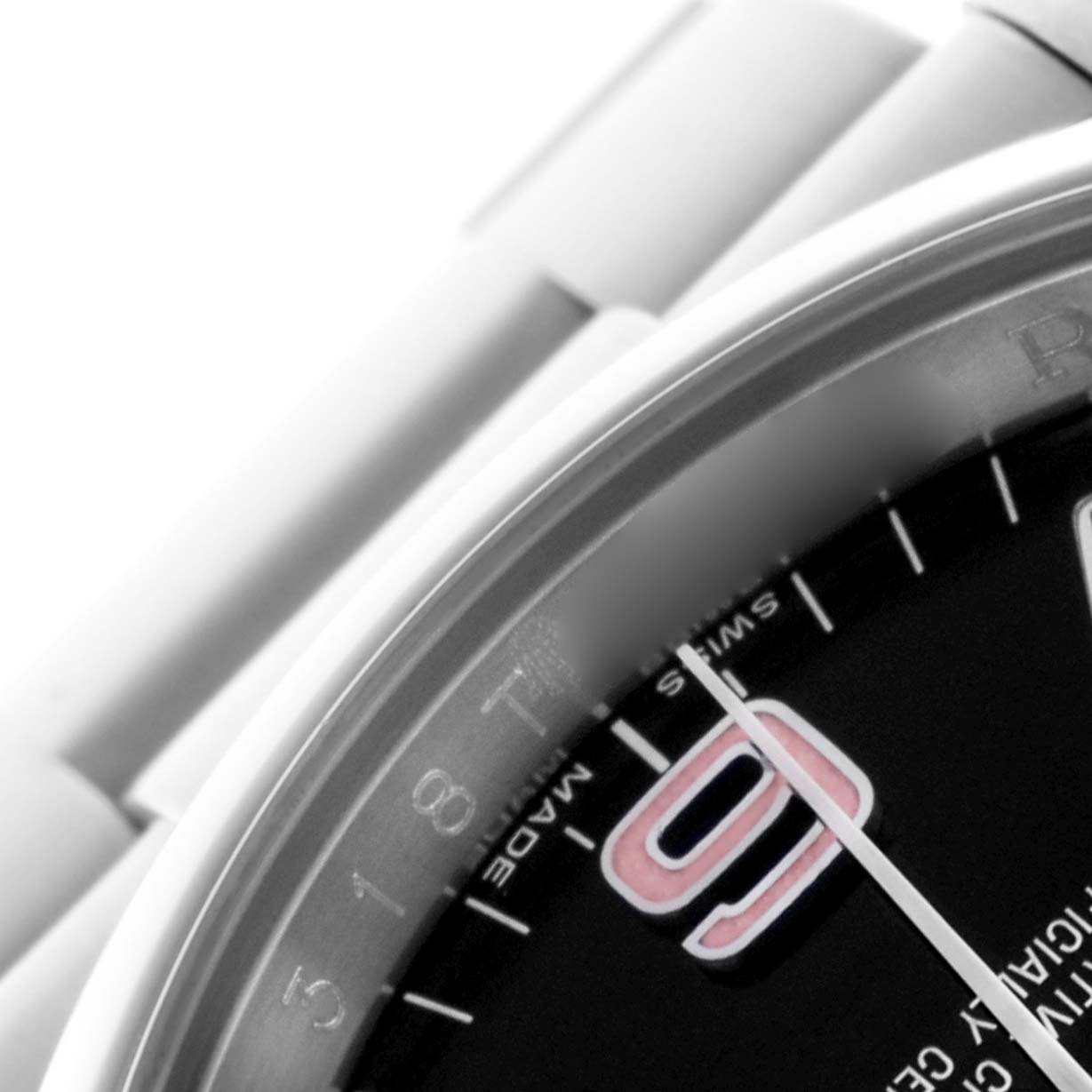 The image shows a close-up angle of the dial and bezel of a Rolex Oyster Perpetual 116000 Men
s Stainless Steel Black Dial 116000 Men
s Stainless Steel Black Dial, highlighting the number 9 and the watch hands.