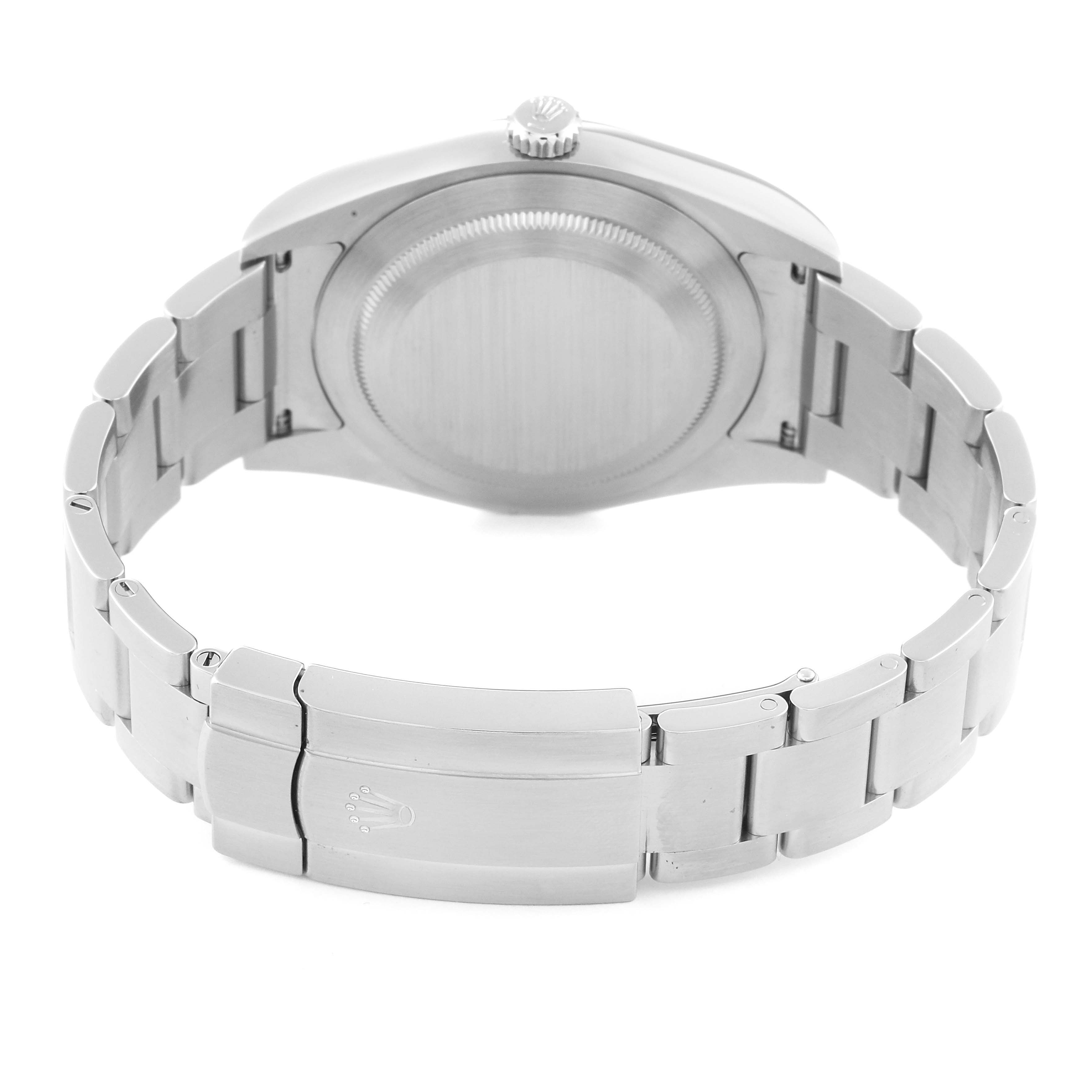 The image shows the back and clasp of a Rolex Oyster Perpetual 114300 Men
s Stainless Steel Black Dial 114300 Men
s Stainless Steel Black Dial watch, featuring a stainless steel bracelet and closed case back.