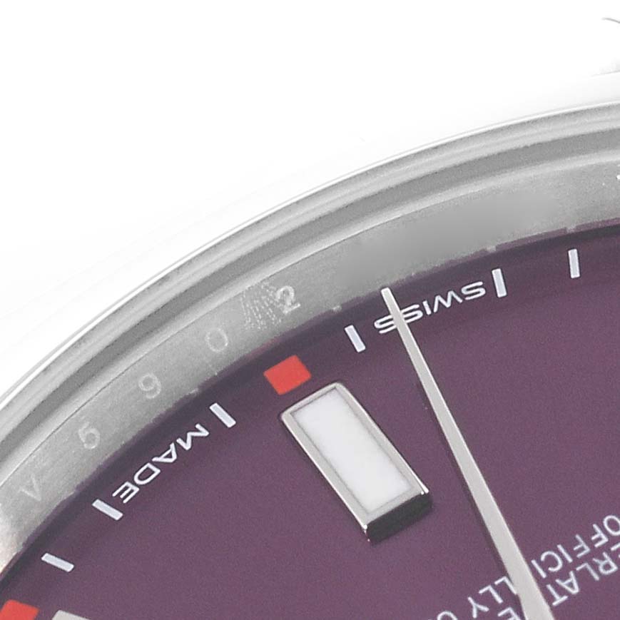 The image shows a close-up of the dial on a Rolex Oyster Perpetual 114300 Men
s Stainless Steel Purple Dial 114300 Men
s Stainless Steel Purple Dial watch, highlighting the "SWISS MADE" marking and indices.