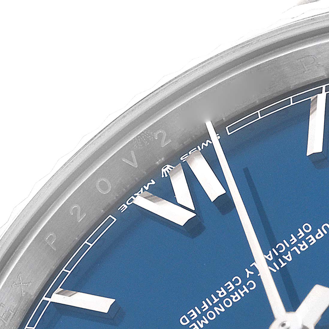 This close-up photo of a Rolex President 228239 Men's White Gold Blue Dial 228239 Men's White Gold Blue Dial model shows part of the blue dial with Roman numerals and a portion of the bezel.