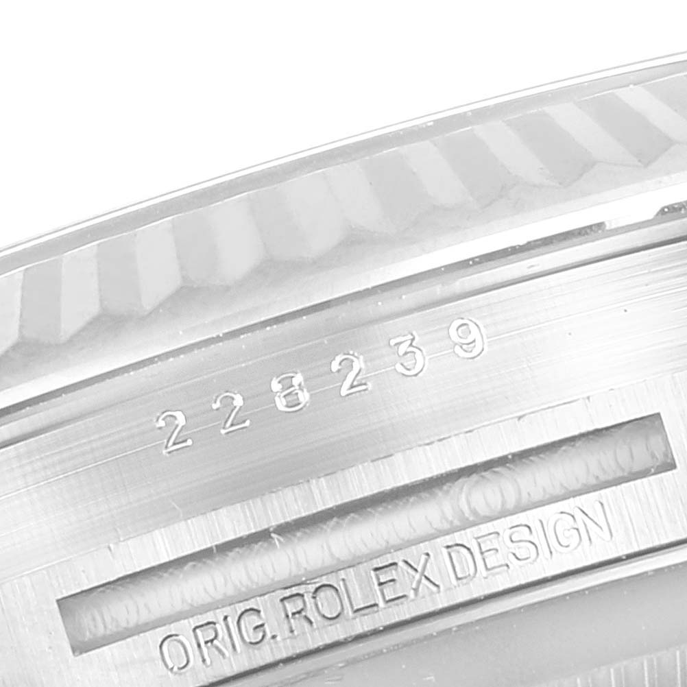 The image shows a close-up view of the case back and serial number engraving on a Rolex President 228239 Men's White Gold Blue Dial 228239 Men's White Gold Blue Dial model.