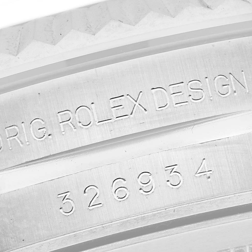 The image shows a close-up of the Rolex Sky-Dweller 326934 Men's Stainless Steel Blue Dial 326934 Men's Stainless Steel Blue Dial's engraved watch case sides, featuring the model and design details.