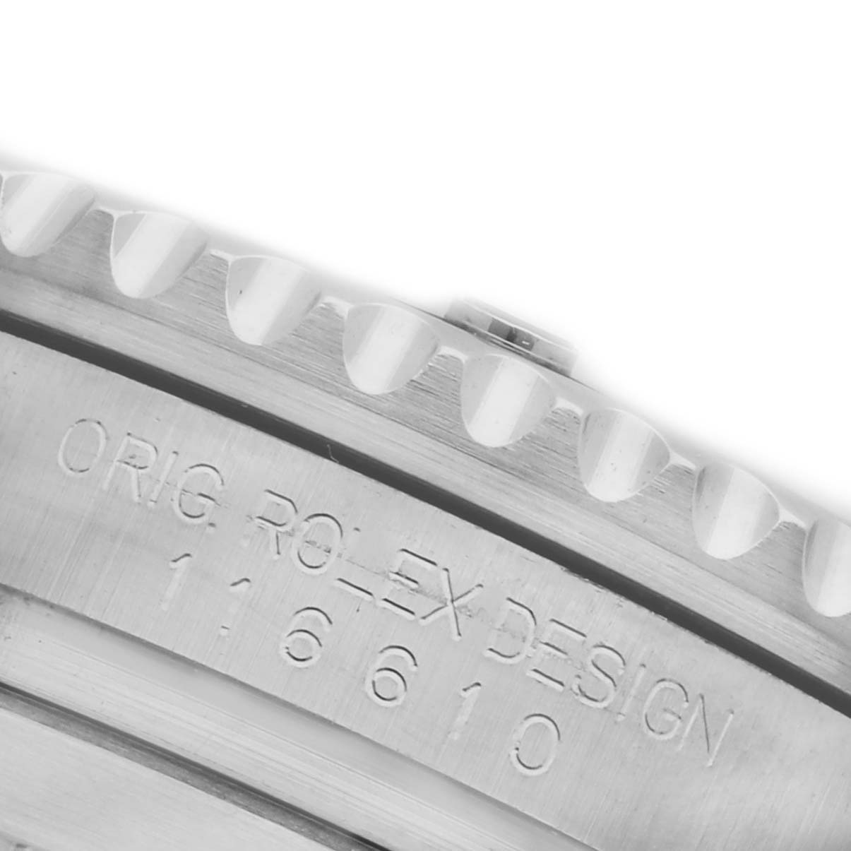 The image shows a close-up of the Rolex Submariner 116610LN Men's Stainless Steel Black Dial 116610LN Men's Stainless Steel Black Dial model's case edge and bezel, highlighting the engraved details and teeth.