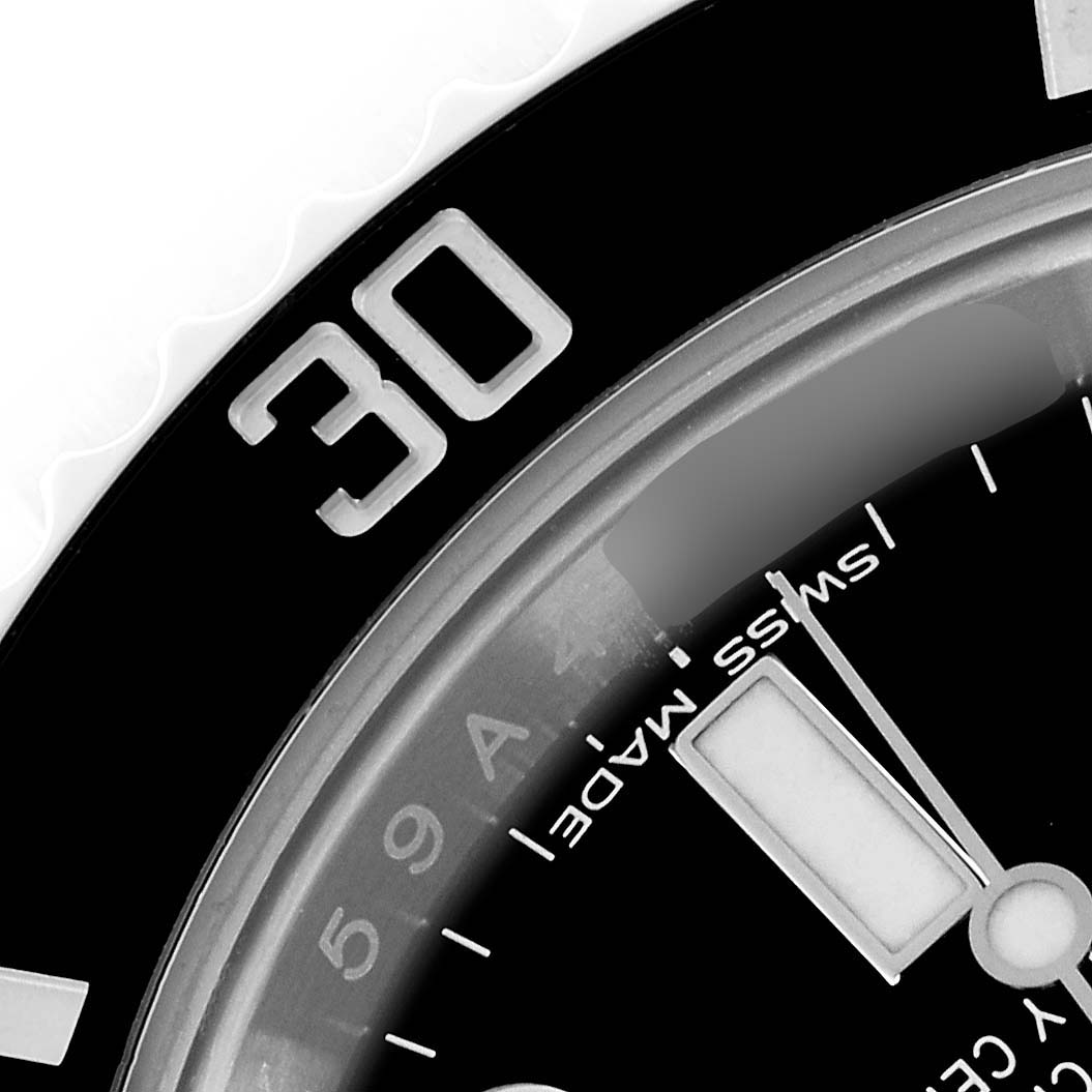The image shows a close-up of the Rolex Submariner 116610LN Men's Stainless Steel Black Dial 116610LN Men's Stainless Steel Black Dial's bezel and dial, featuring the number 30 and details like "Swiss Made."