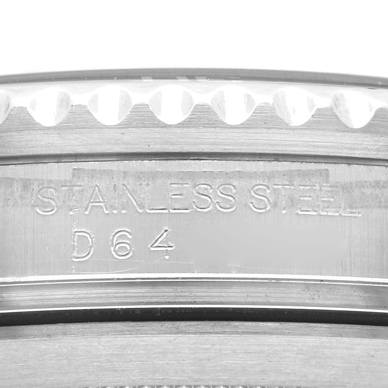 This image shows a close-up of the bezel and engraved markings indicating stainless steel on a Rolex Submariner 16610 Men
s Stainless Steel Black Dial 16610 Men
s Stainless Steel Black Dial watch.