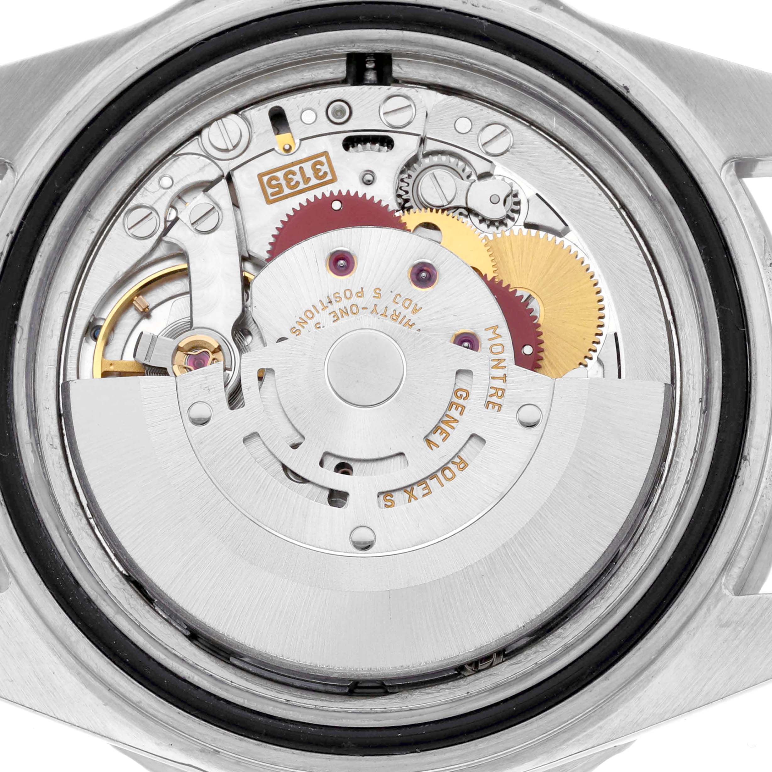 This image shows the movement of a Rolex Submariner 16610 Men's Stainless Steel Black Dial 16610 Men's Stainless Steel Black Dial watch, highlighting intricate gears and components.