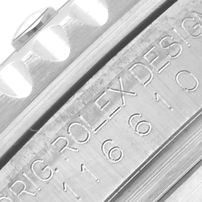 The image shows a close-up angle of the bezel and engraved details of the Rolex Submariner 116610LV Men's Stainless Steel Green Dial 116610LV Men's Stainless Steel Green Dial watch.